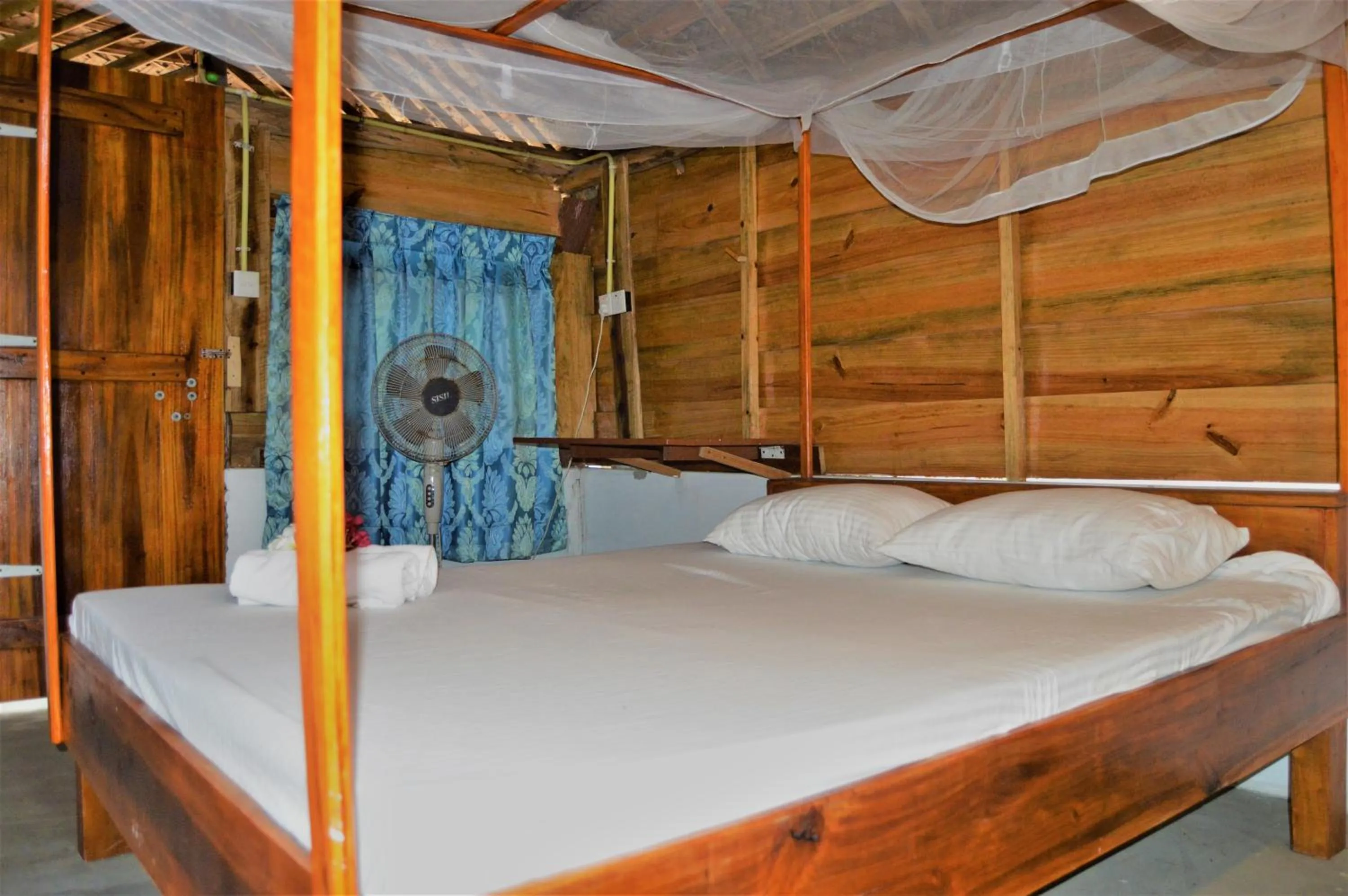 Bed in Shim Beach Resort