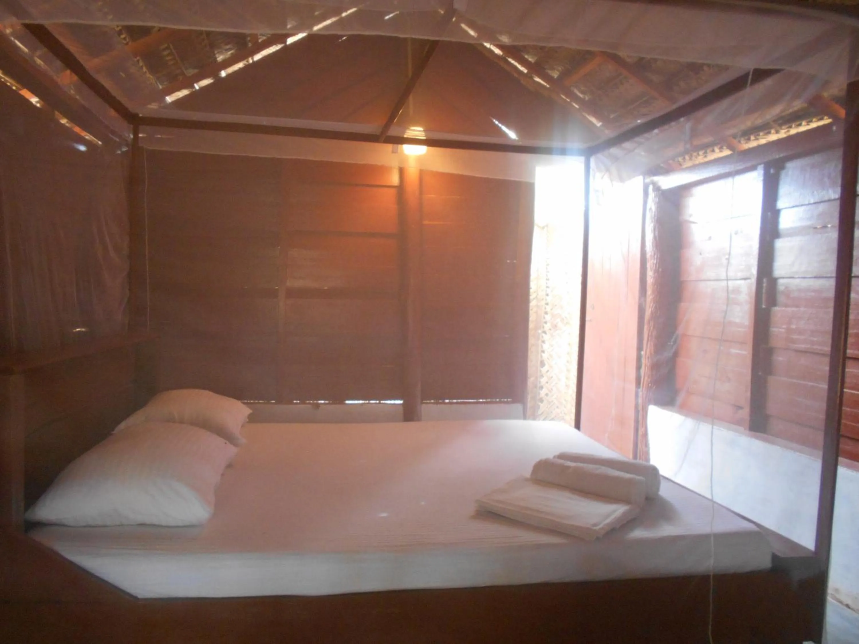 Bed in Shim Beach Resort