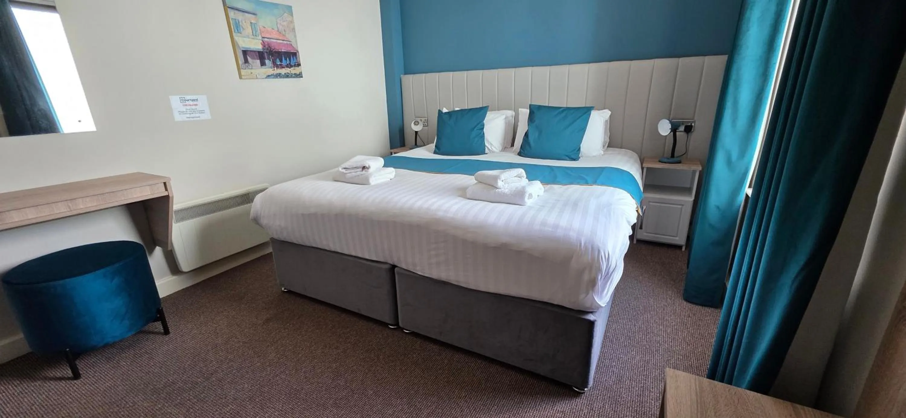 Bed in The Courtyard Apartments