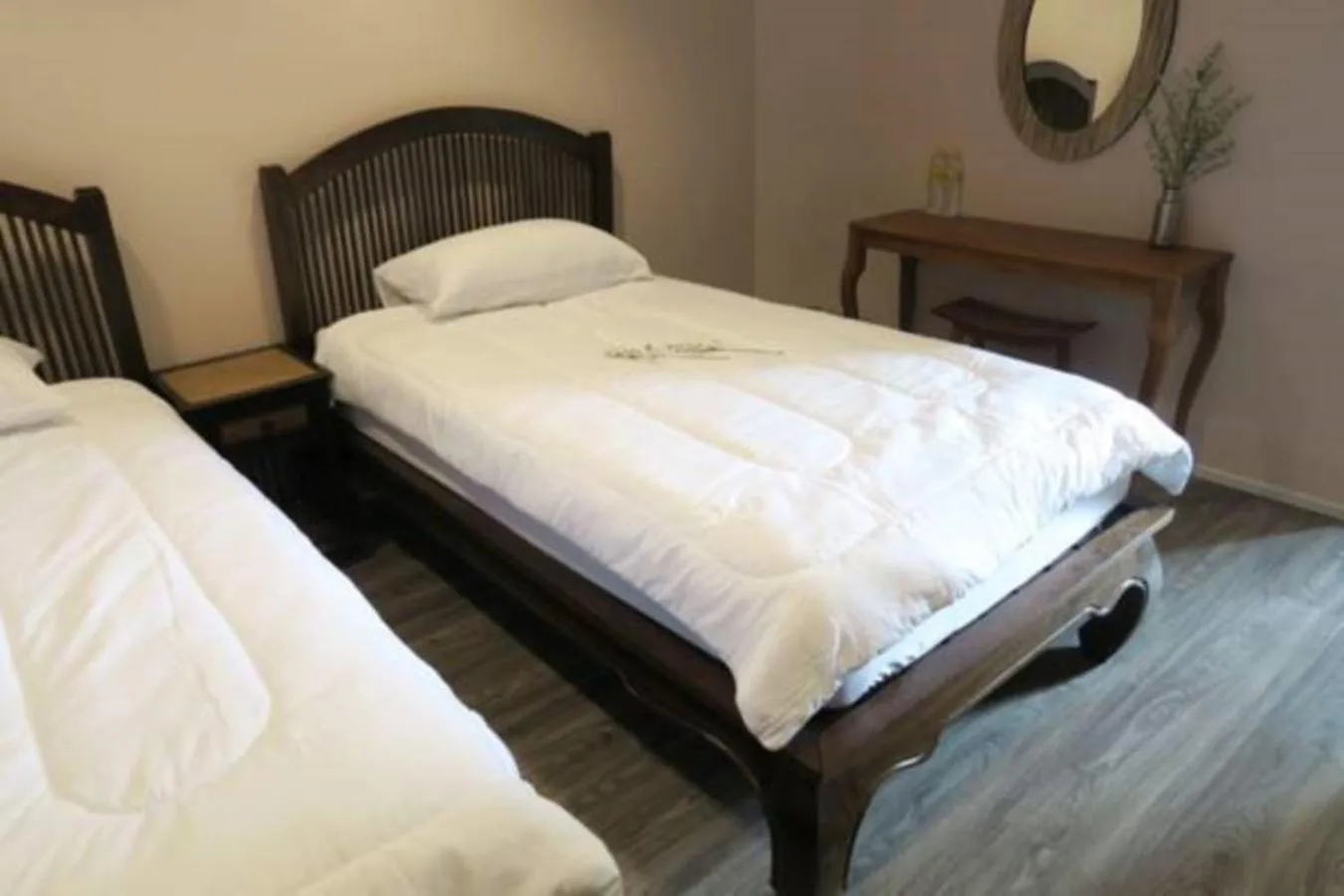 Bed in The Grand Palace Hotel