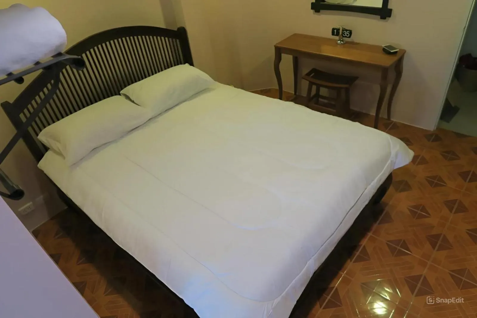 Bed in The Grand Palace Hotel