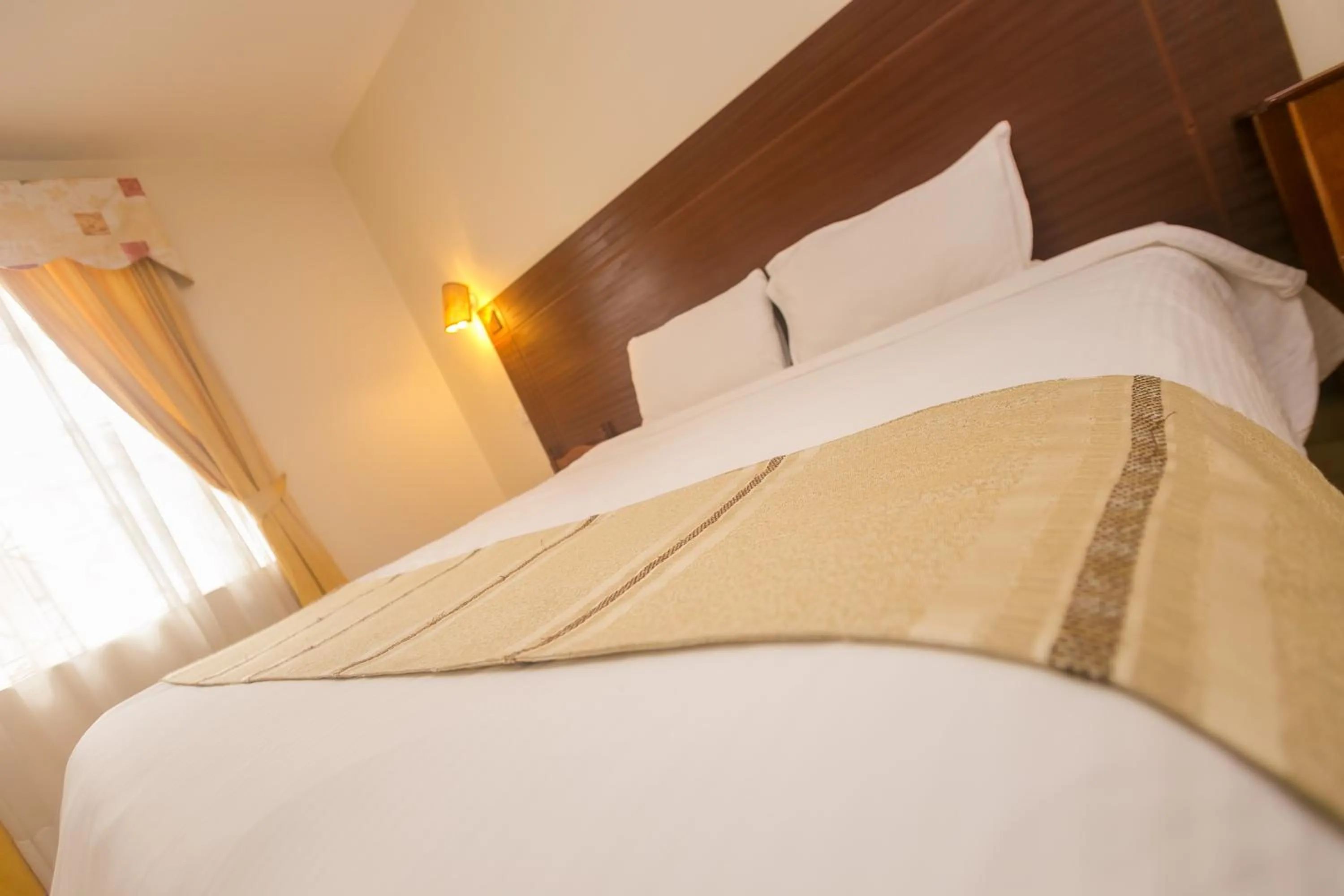 Bed in Corat Africa Hotel