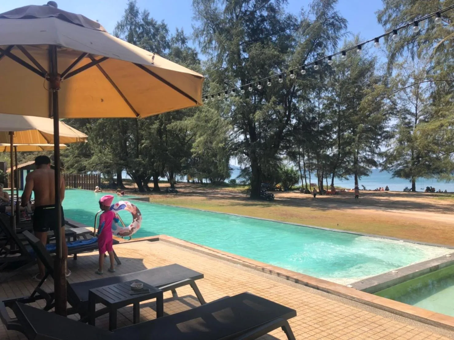 People in Coriacea Beachfront Boutique Phuket Resort