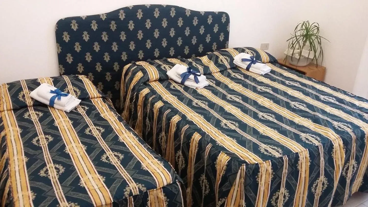 Bed in Hotel Ambrogini