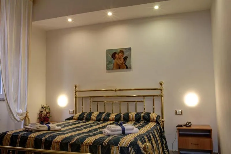 Bed in Hotel Ambrogini
