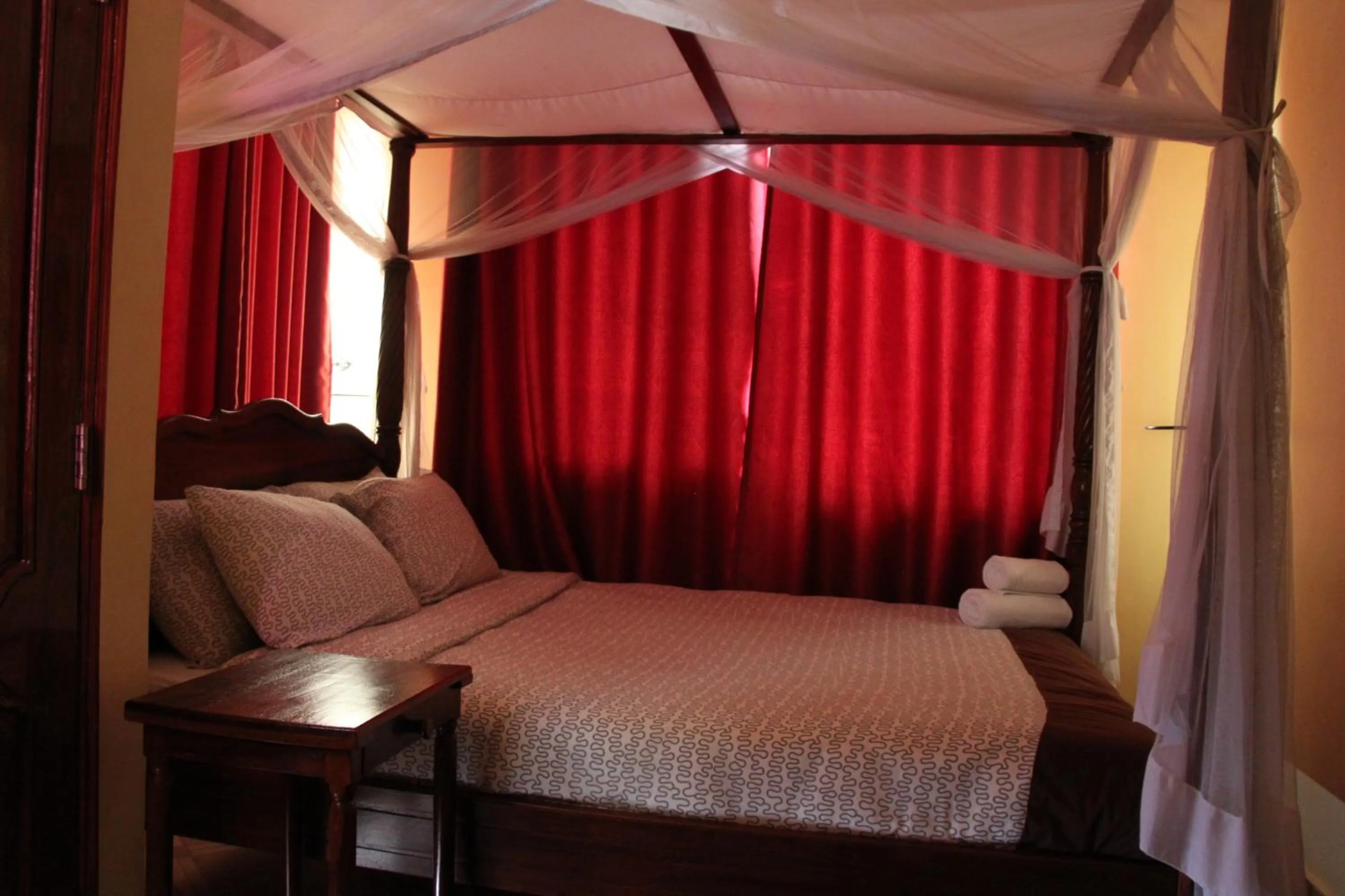 Bed in East Point Hotel Moshi