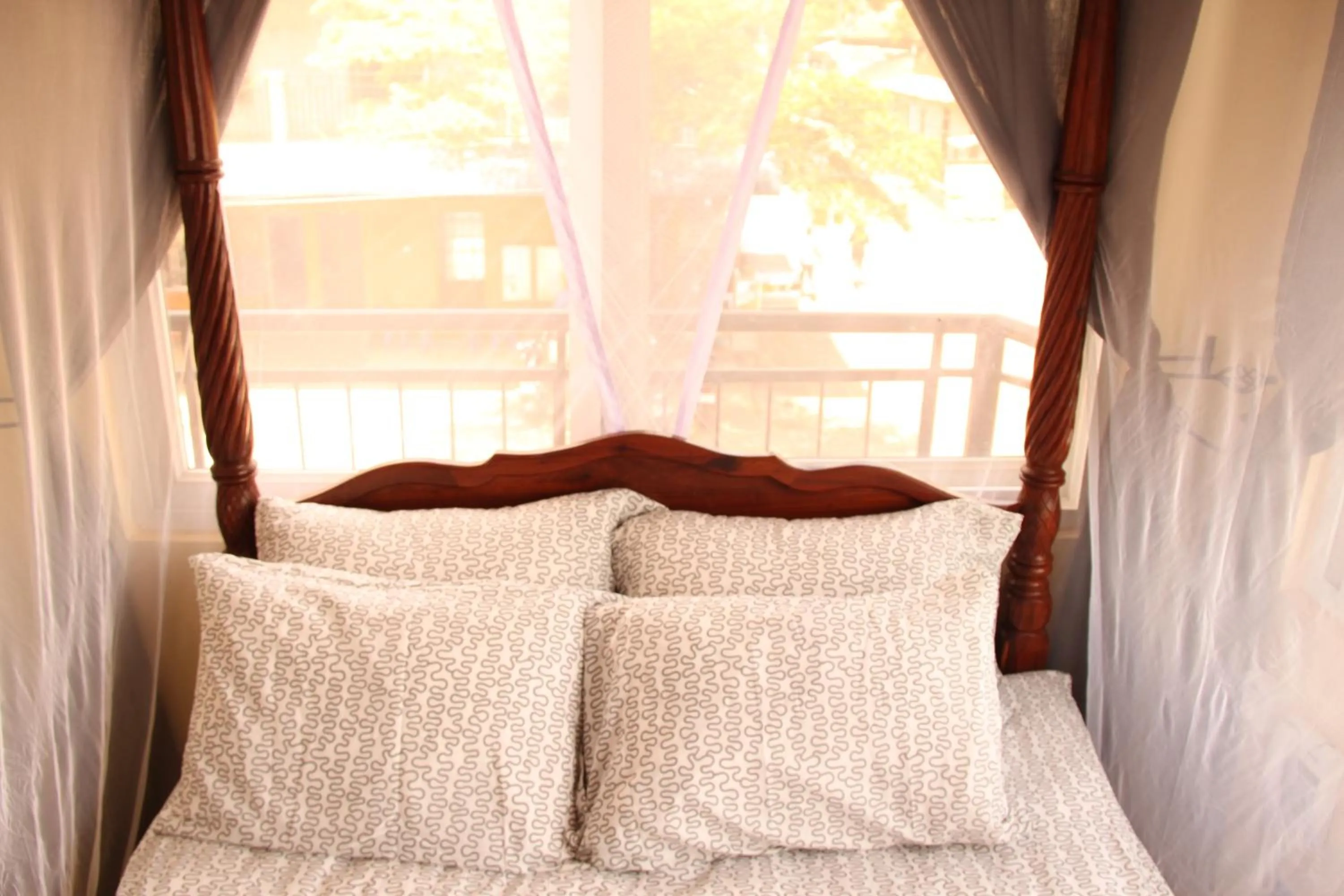 Bed in East Point Hotel Moshi