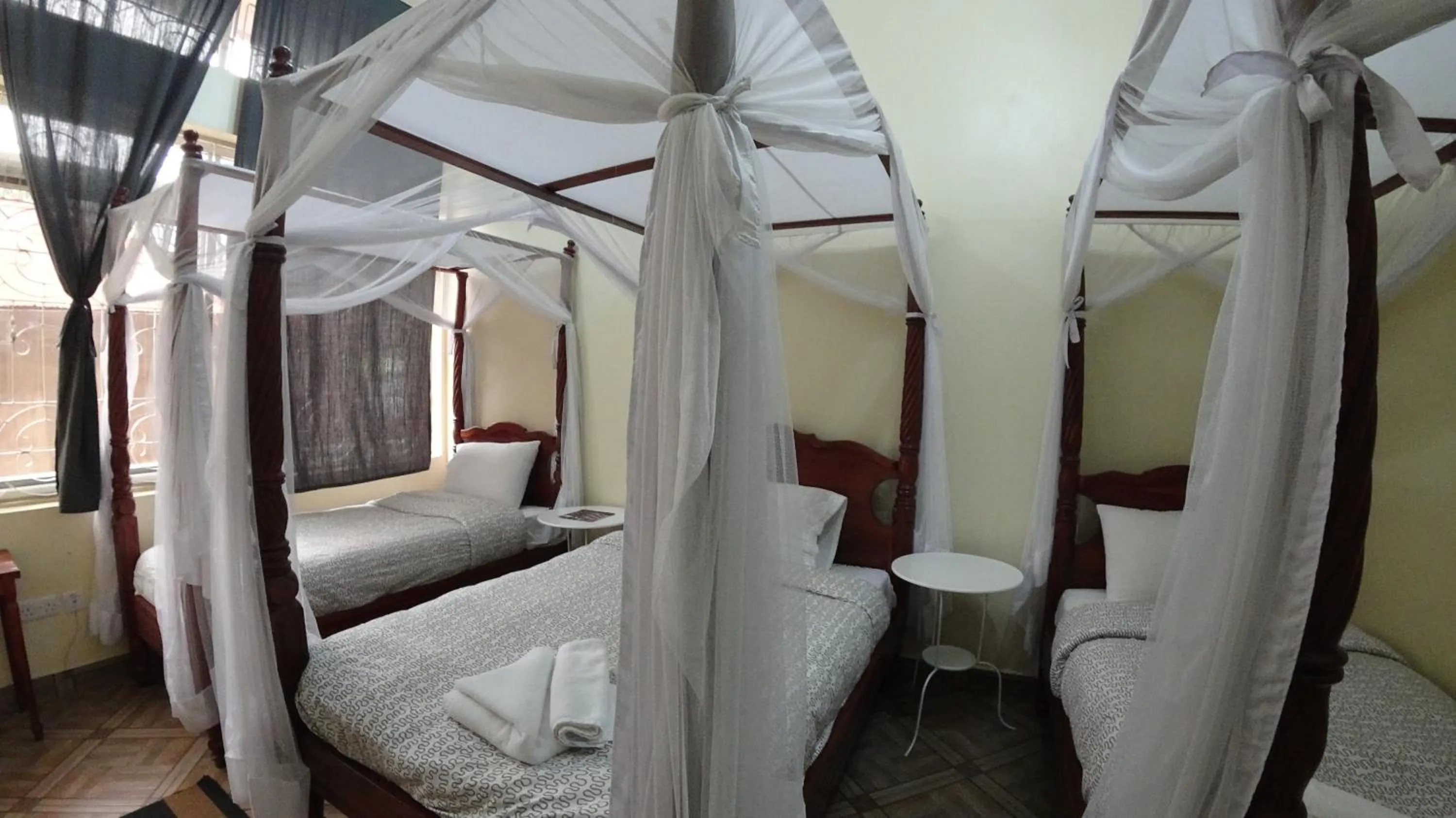 Bed in East Point Hotel Moshi