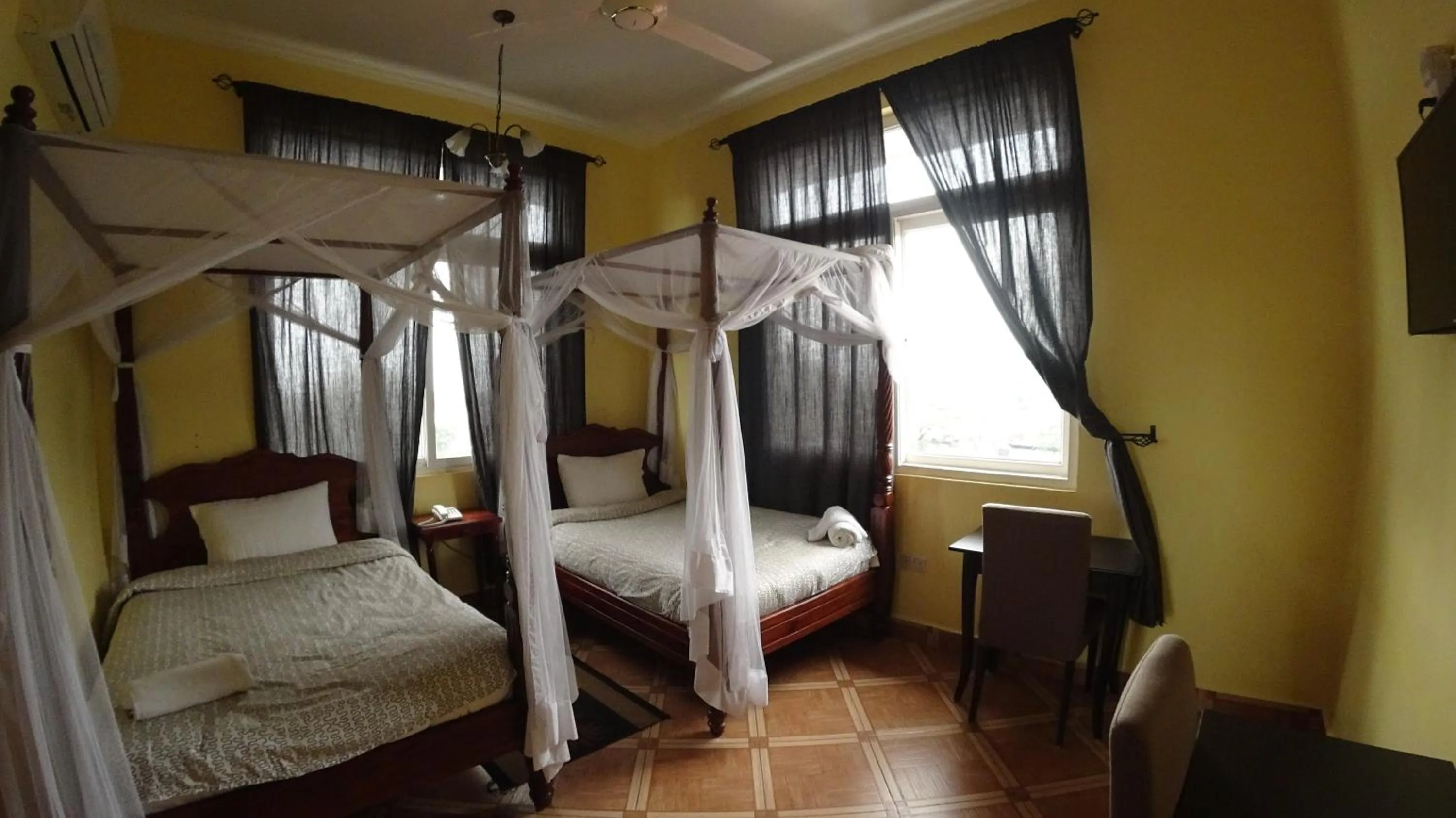 Bed in East Point Hotel Moshi