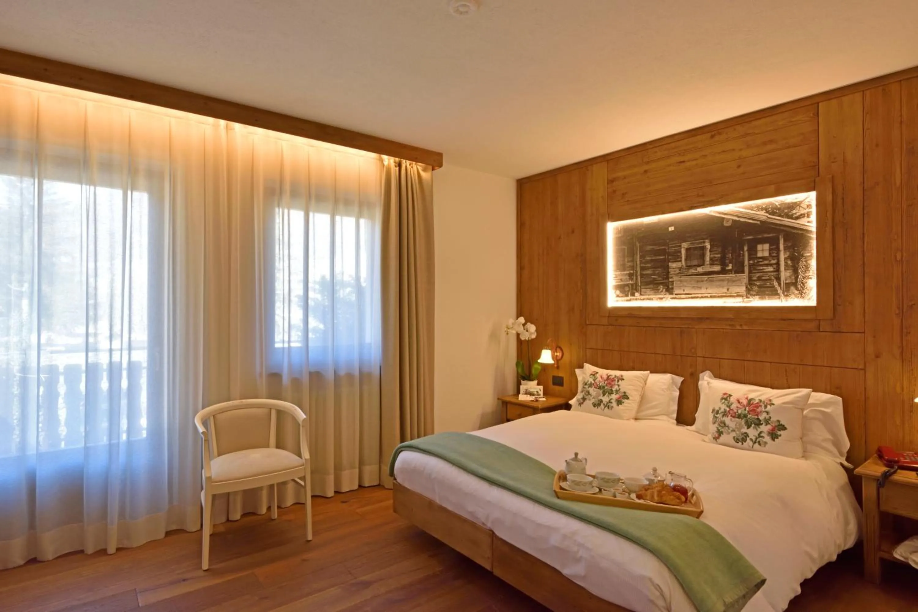 Bed in Hotel Beau Sejour