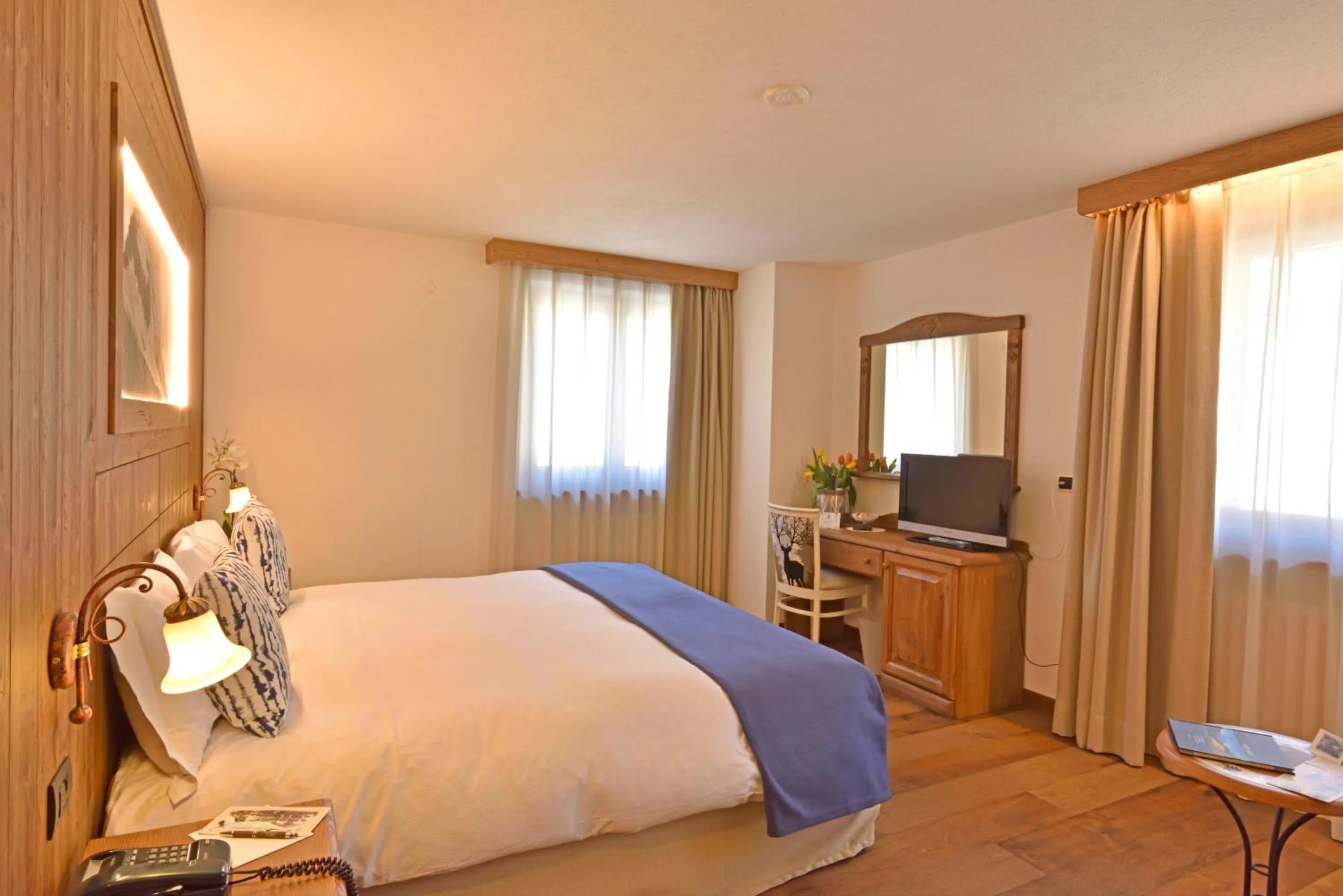 Bed in Hotel Beau Sejour