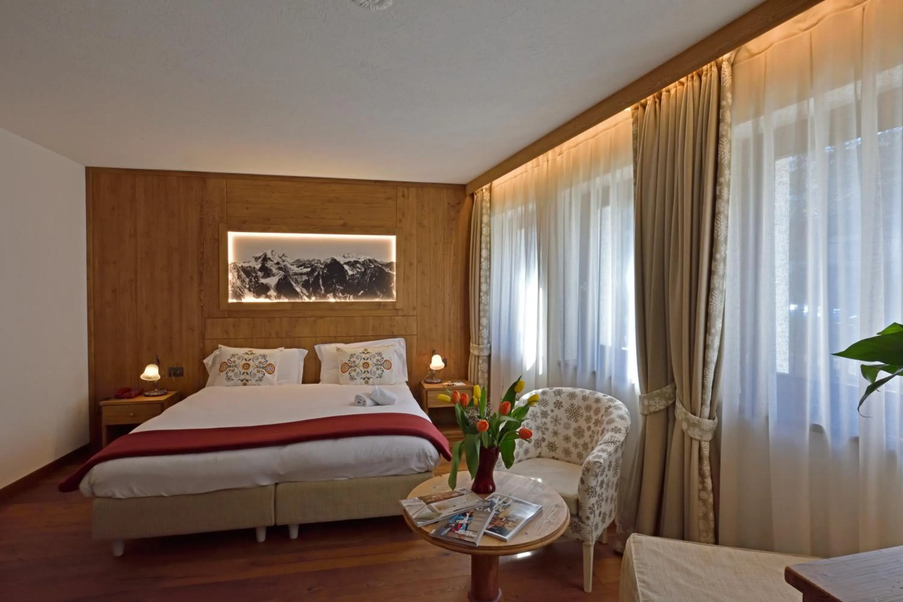 Bed in Hotel Beau Sejour