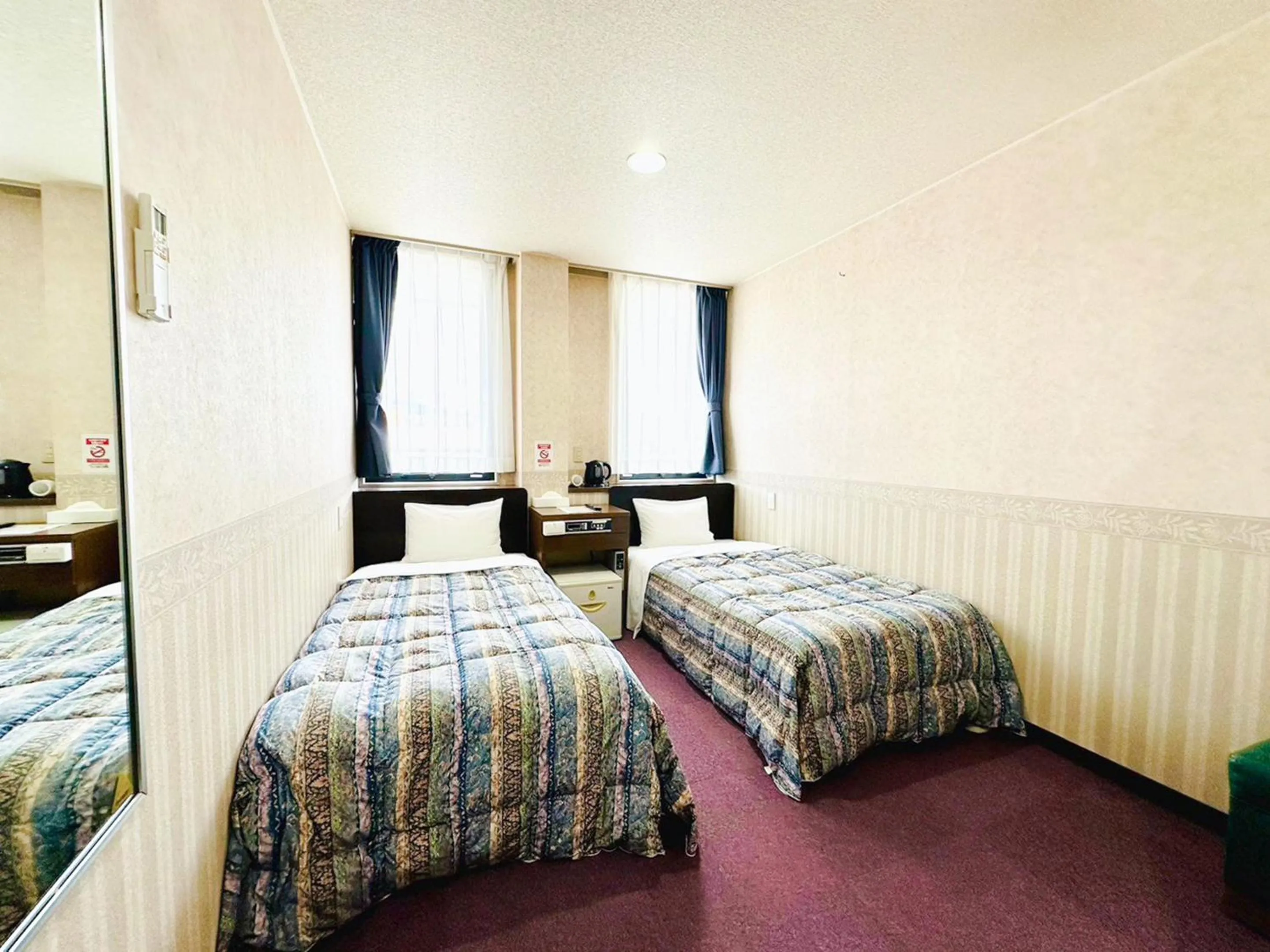 Photo of the whole room, Bed in Station Business Hotel Tenshukaku