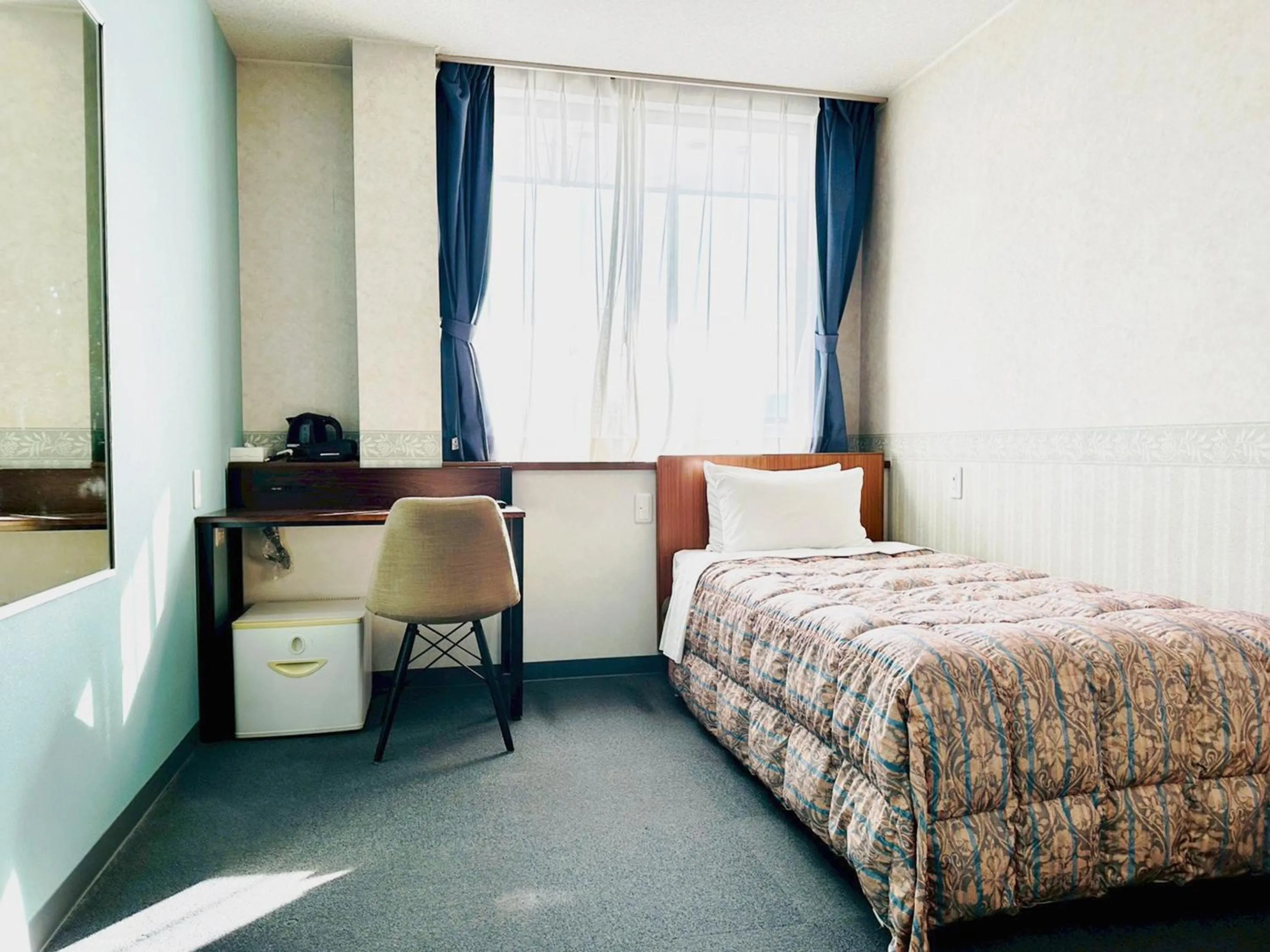 Bed in Station Business Hotel Tenshukaku