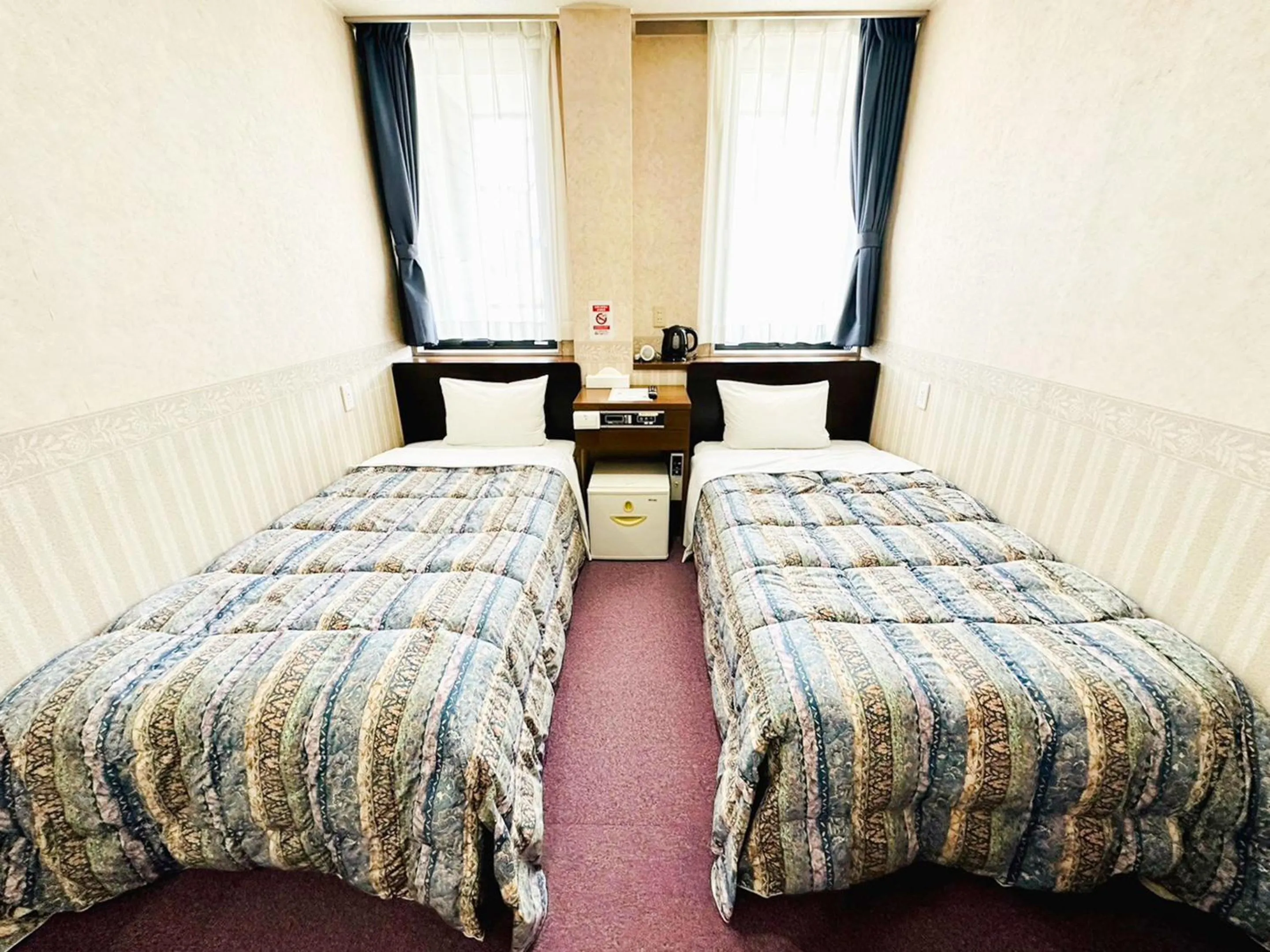 Photo of the whole room, Bed in Station Business Hotel Tenshukaku