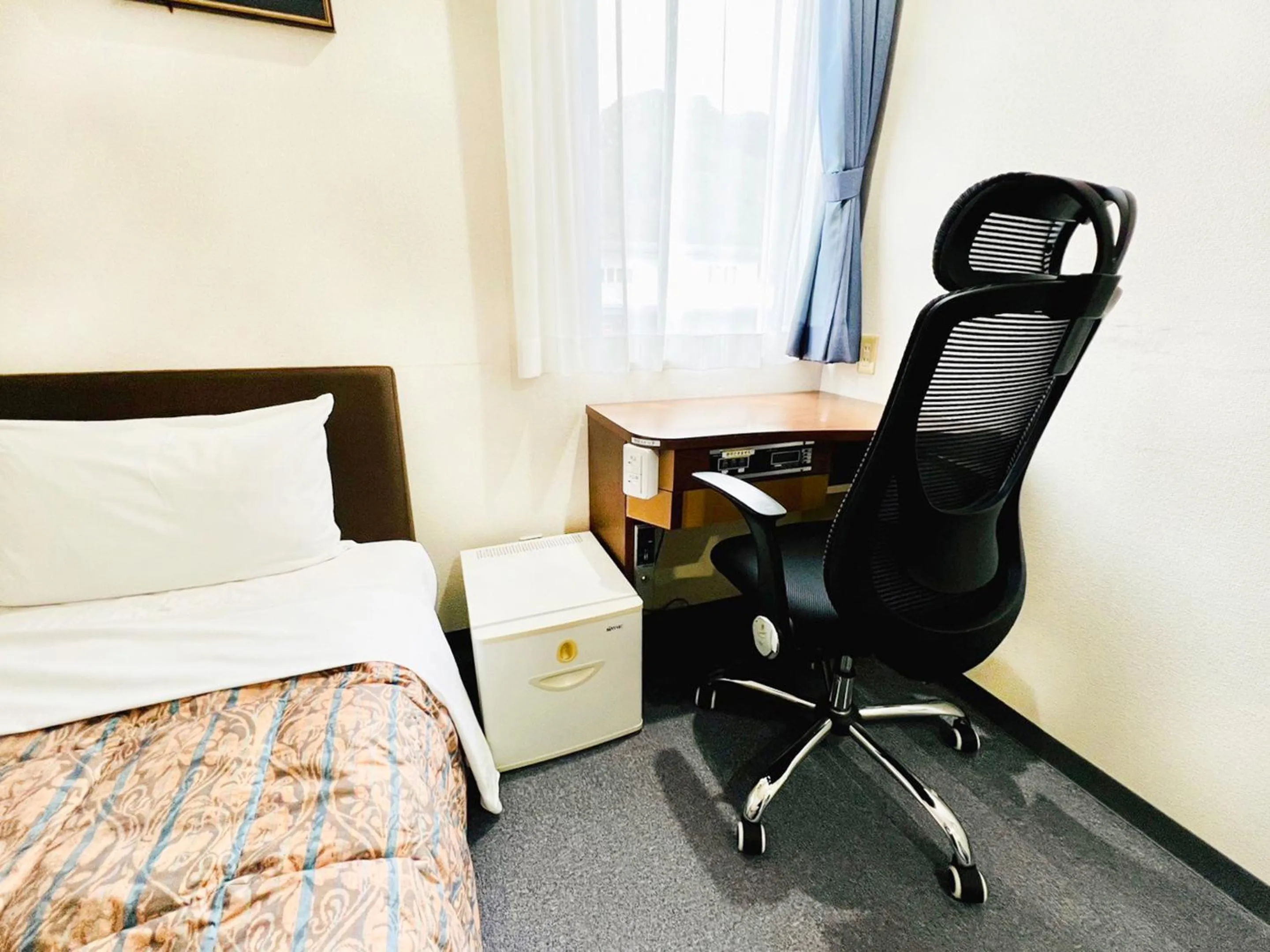 Photo of the whole room, Bed in Station Business Hotel Tenshukaku