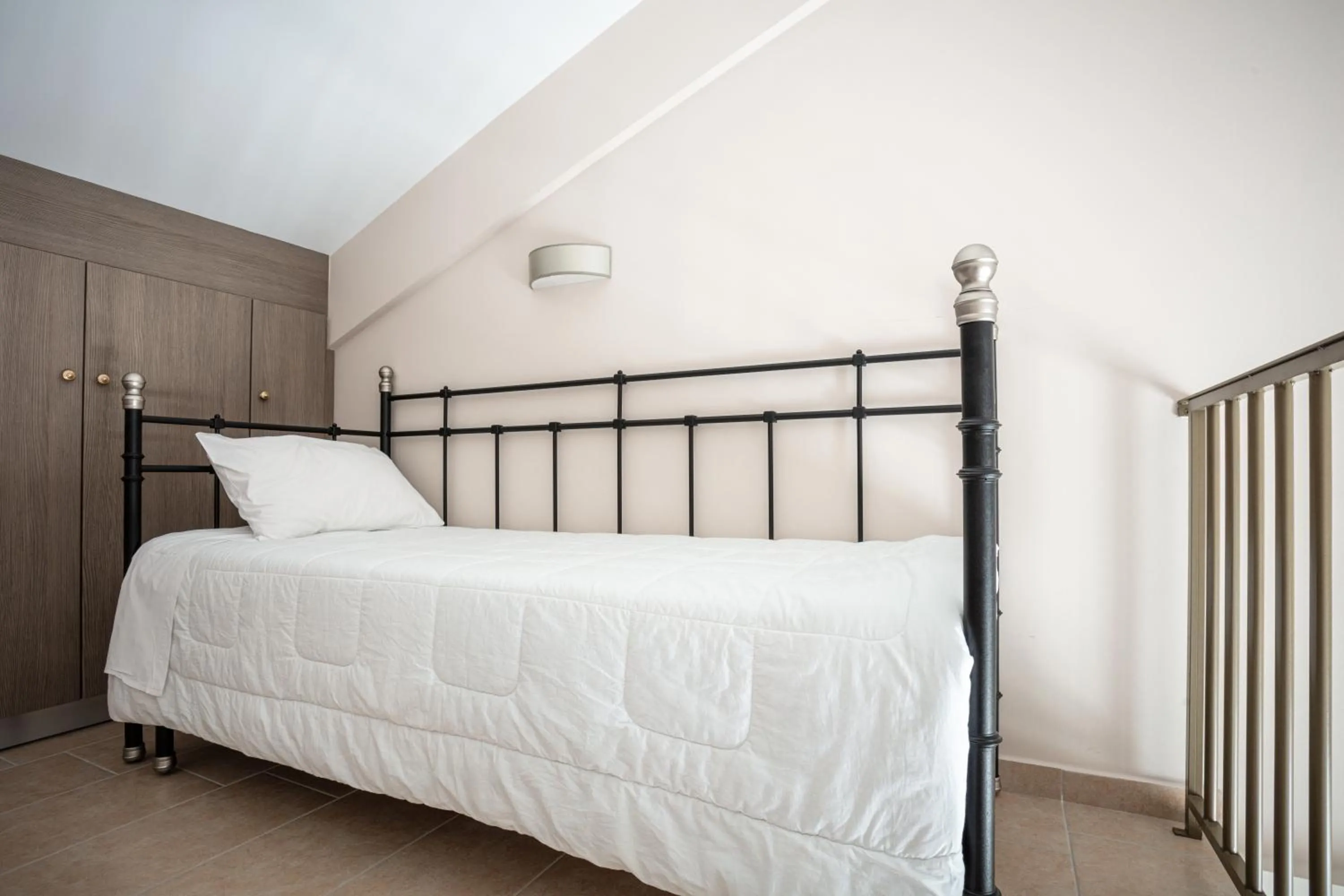 Bed in Royalty Suites Seaside