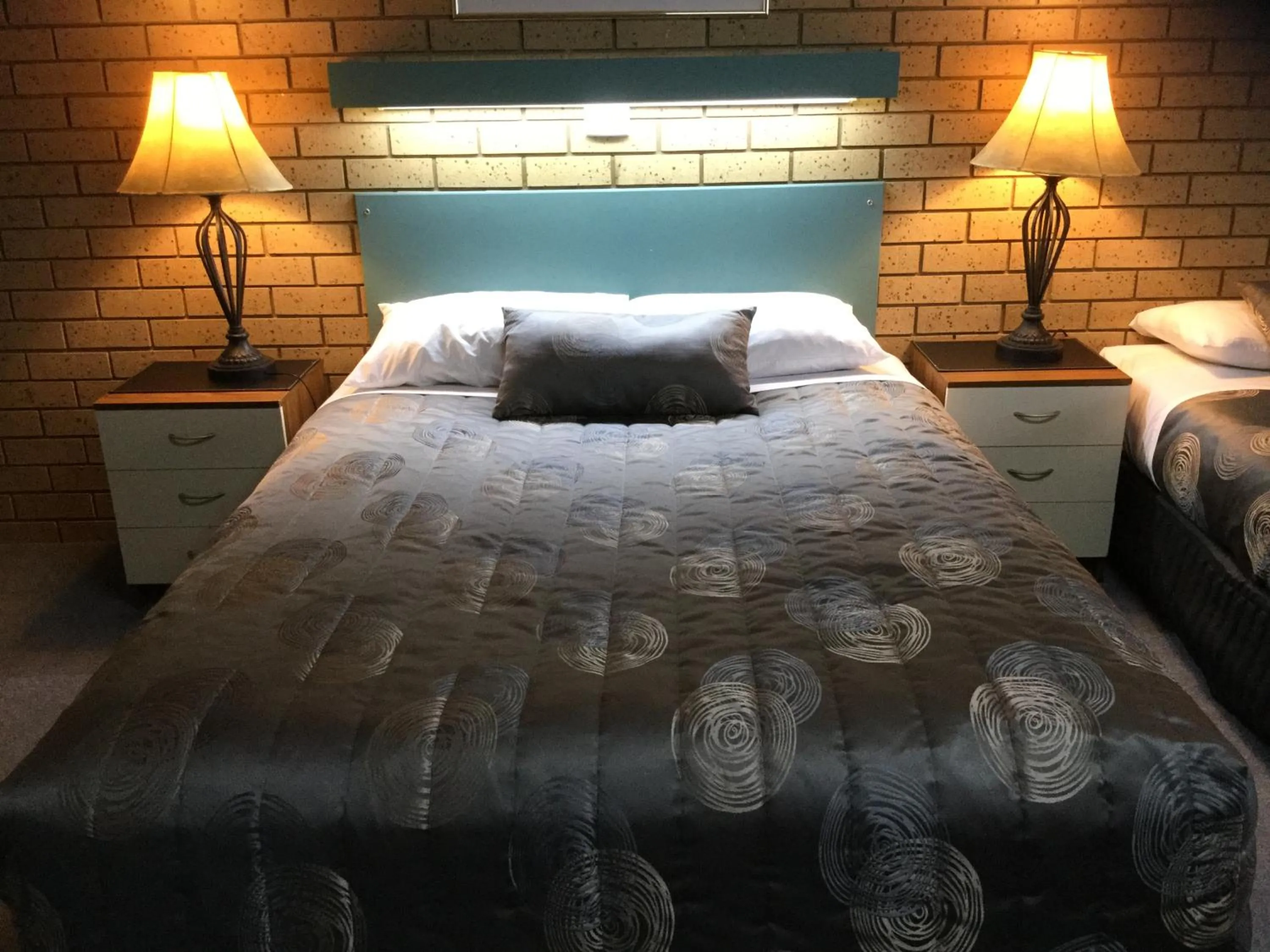 Bed in Sunrise Motel