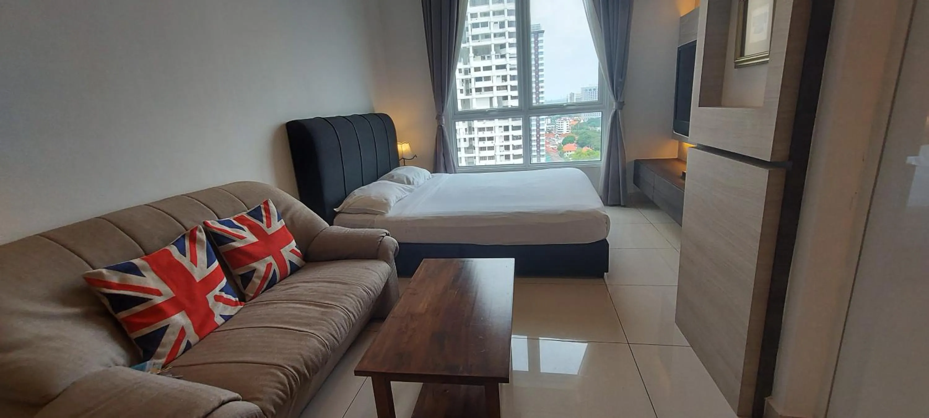 Bed in Merlene Suites at Mansion One Formerly know as Mansion One Suites