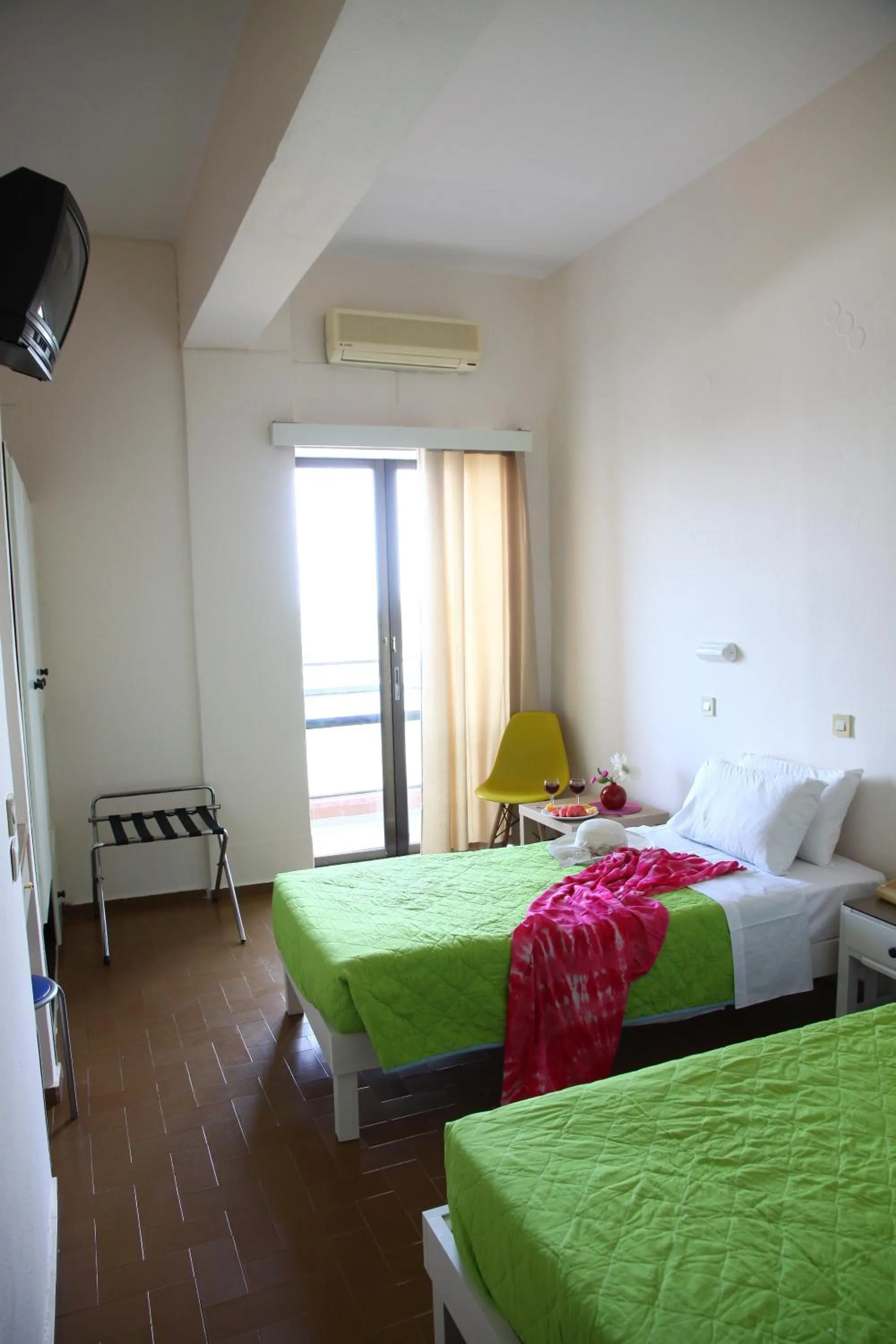 Bedroom in Triton Garden Hotel