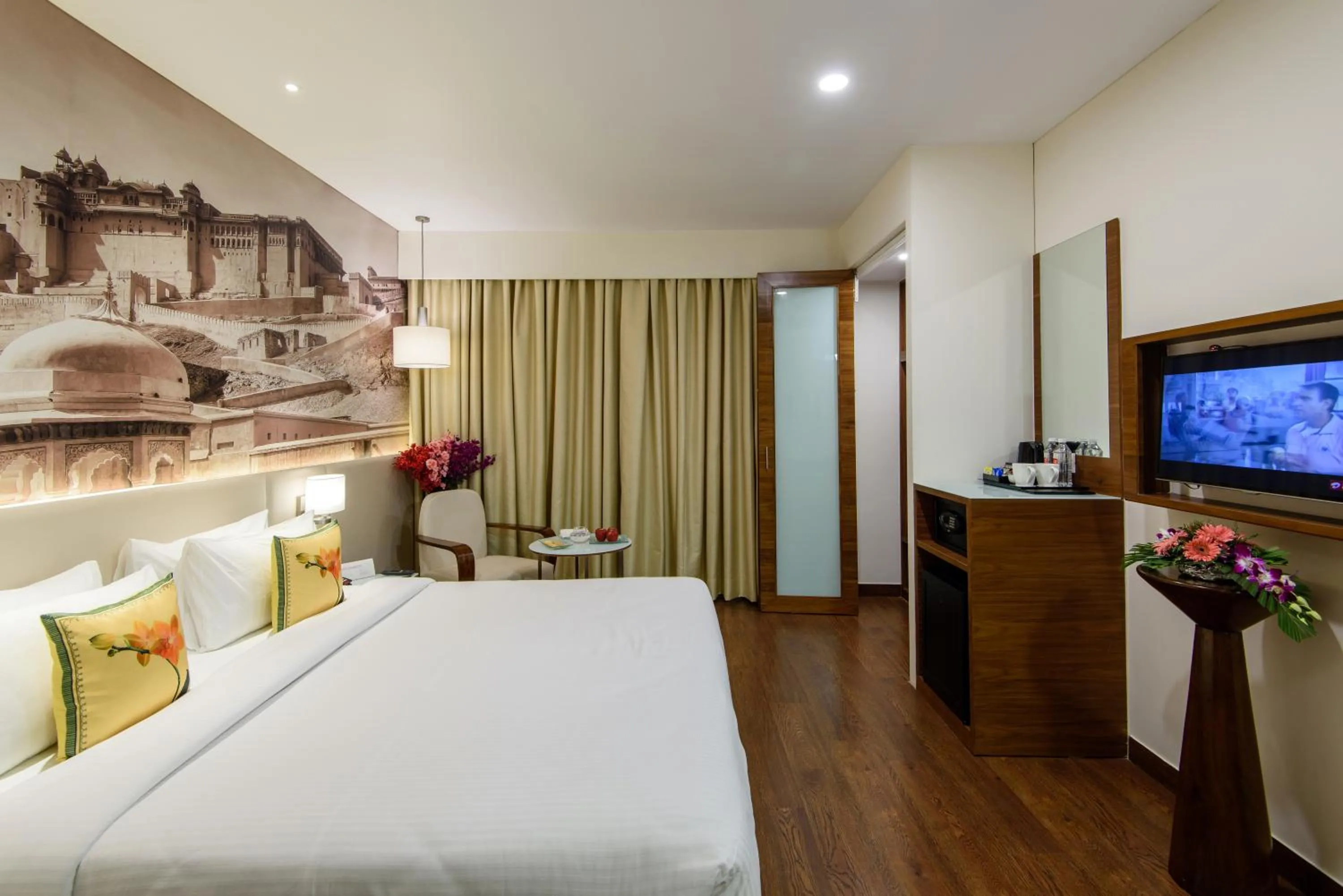 Communal lounge/ TV room, Bed in Regenta Central Jaipur