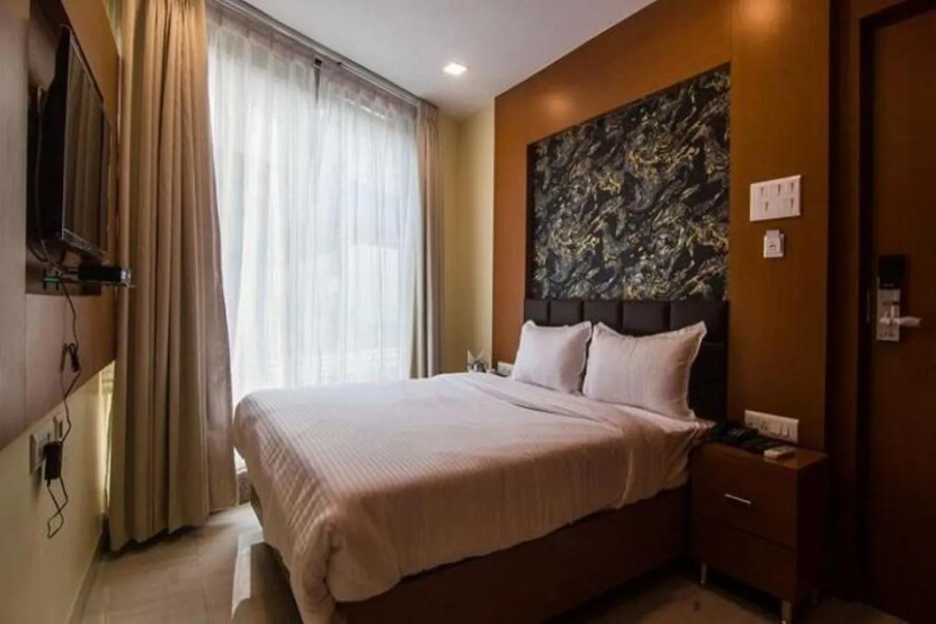 Bed in Hotel Sawood International