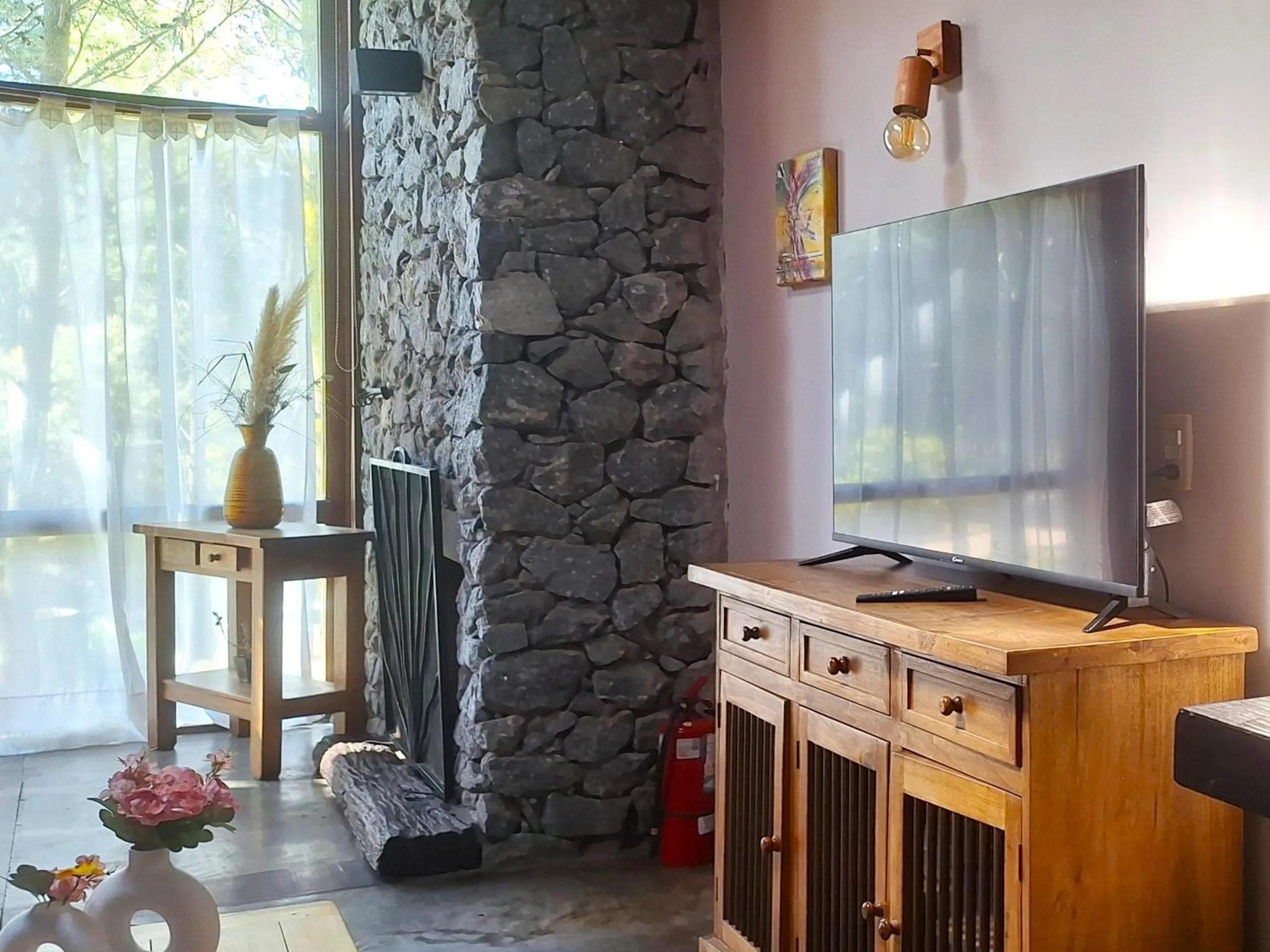 TV and multimedia in Altos Medanos Cabañas & Club de Bosque