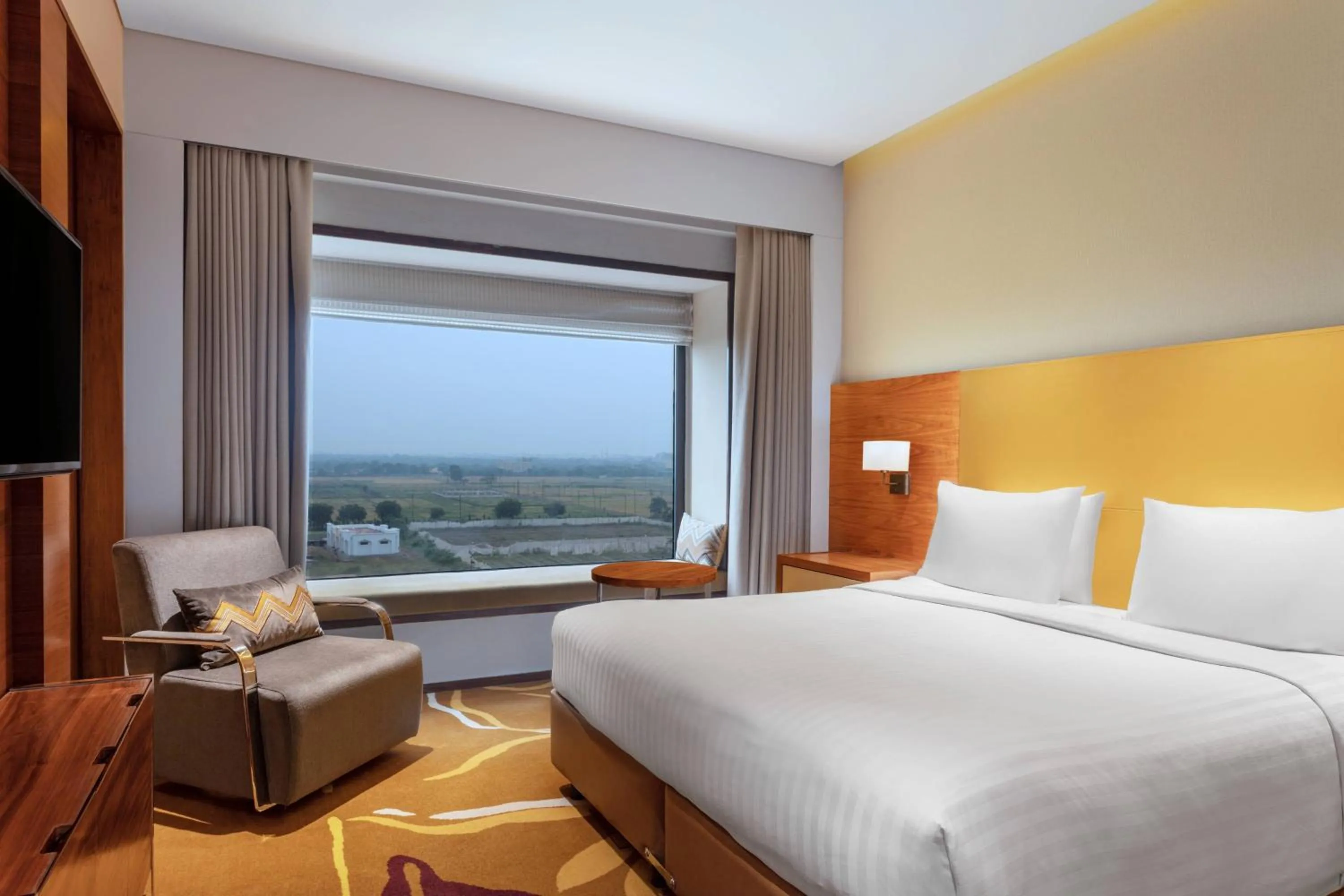 Bedroom, Bed in Courtyard by Marriott Raipur