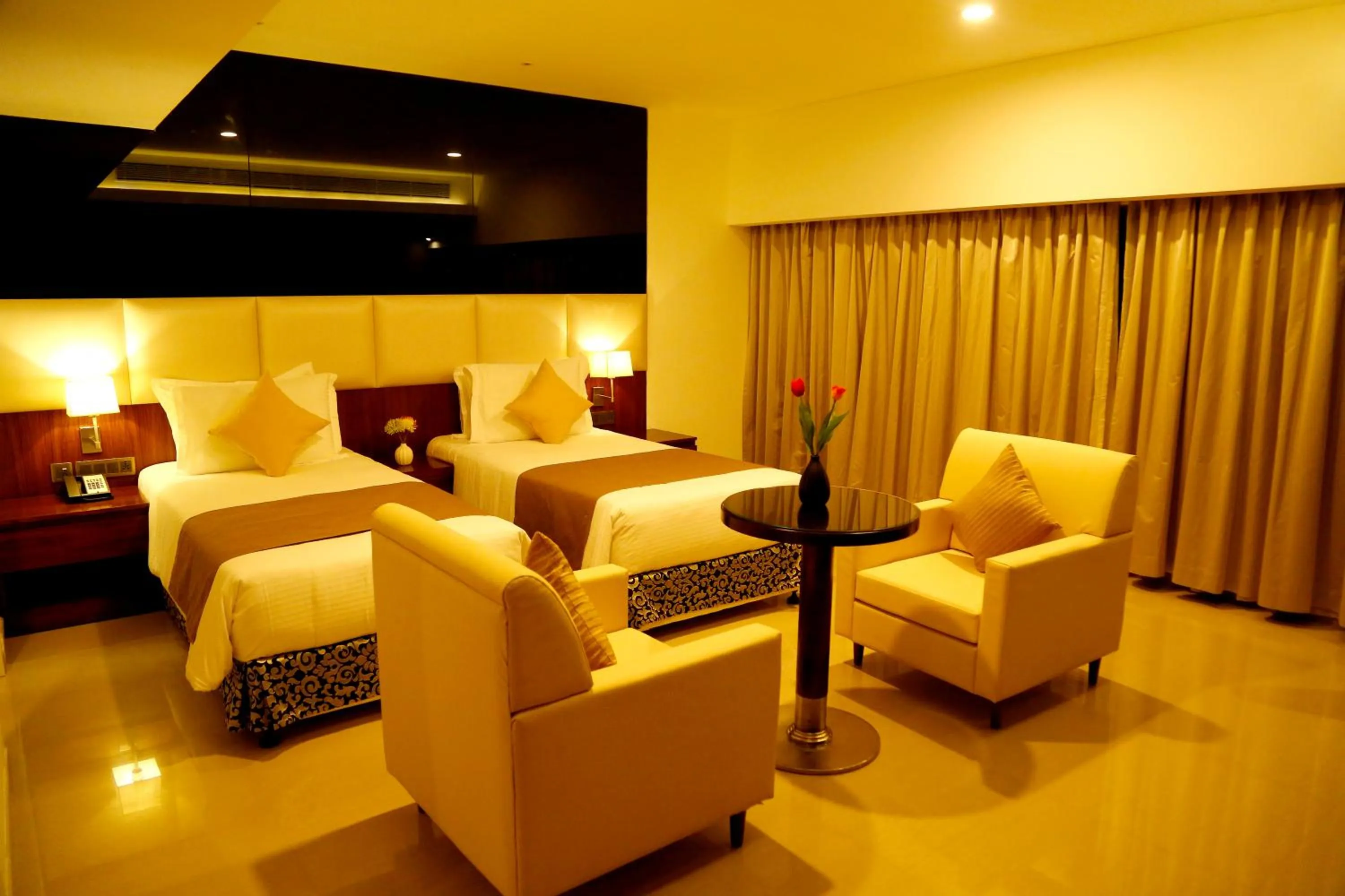 Photo of the whole room, Bed in The Raviz Calicut