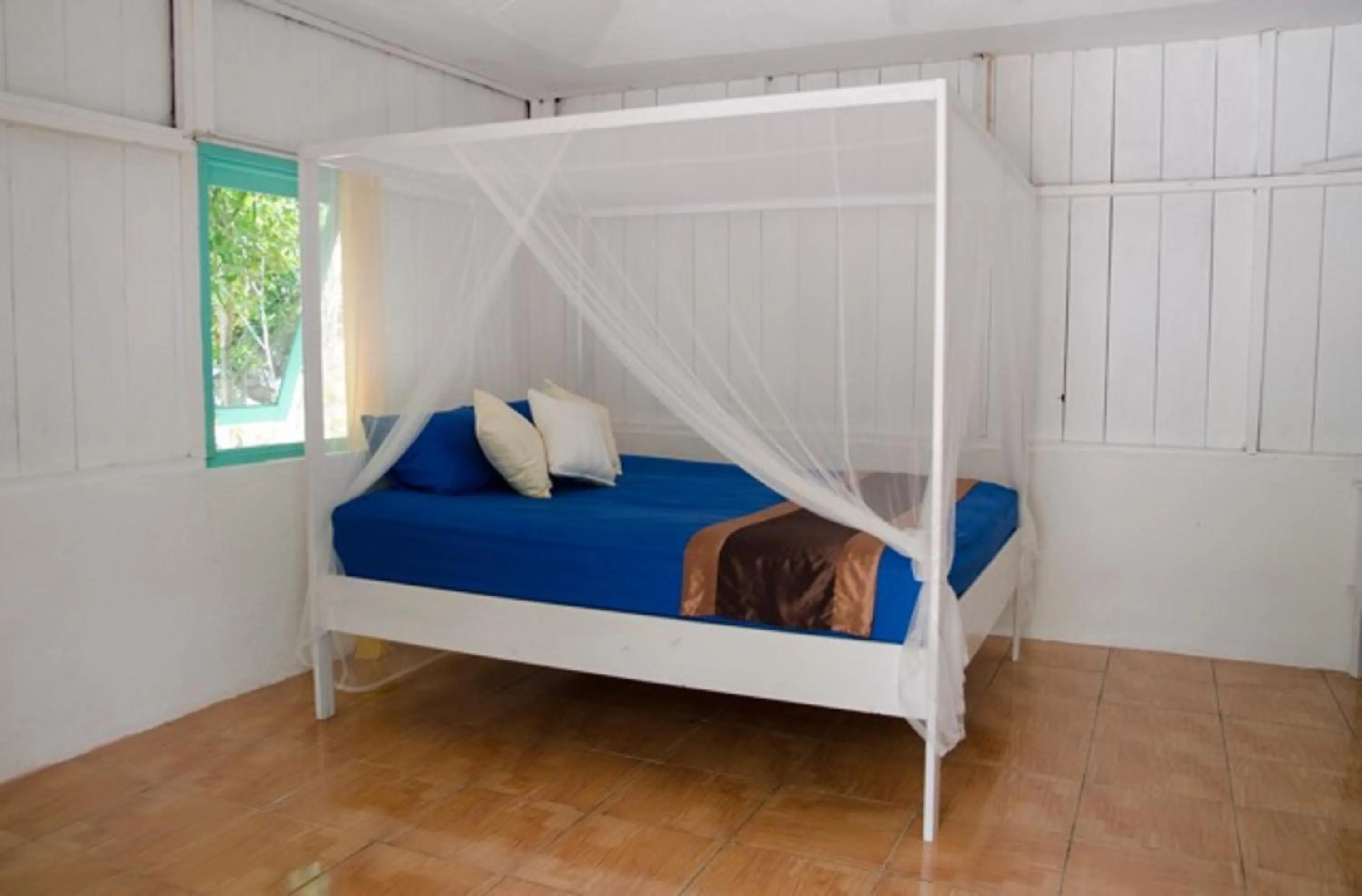 Bed in Scuba Republic Beach Bungalows