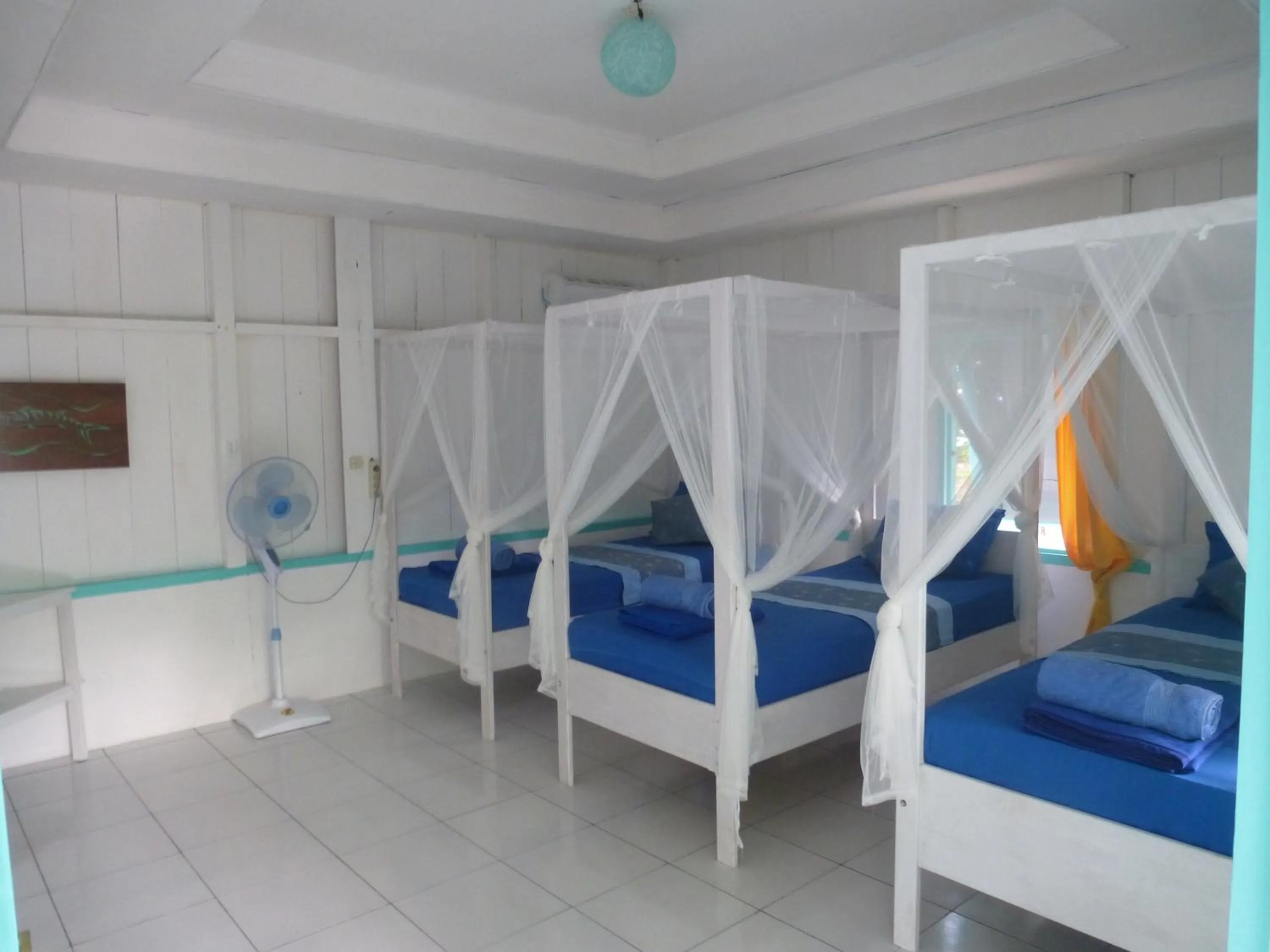 Bed in Scuba Republic Beach Bungalows