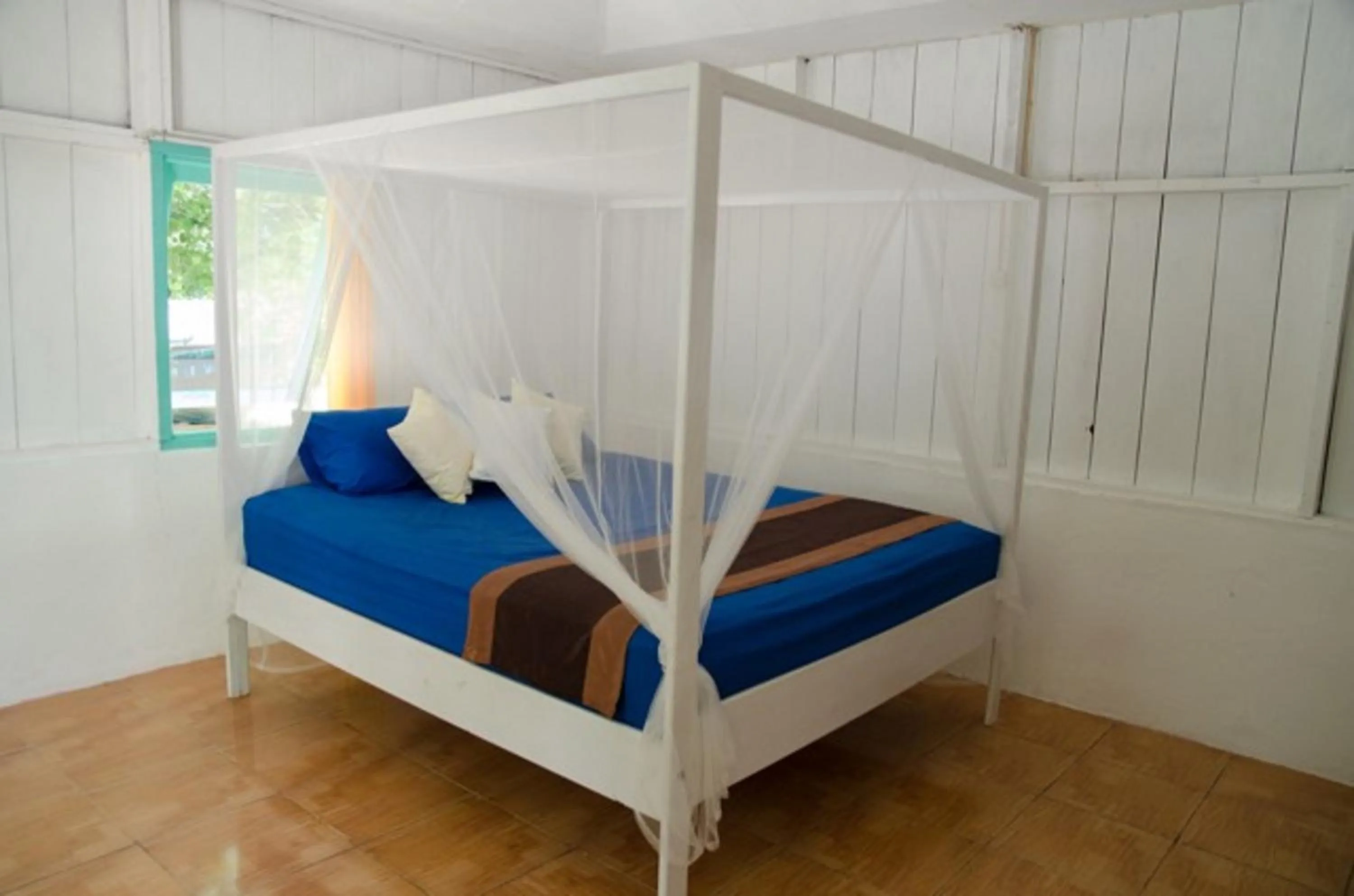 Bed in Scuba Republic Beach Bungalows
