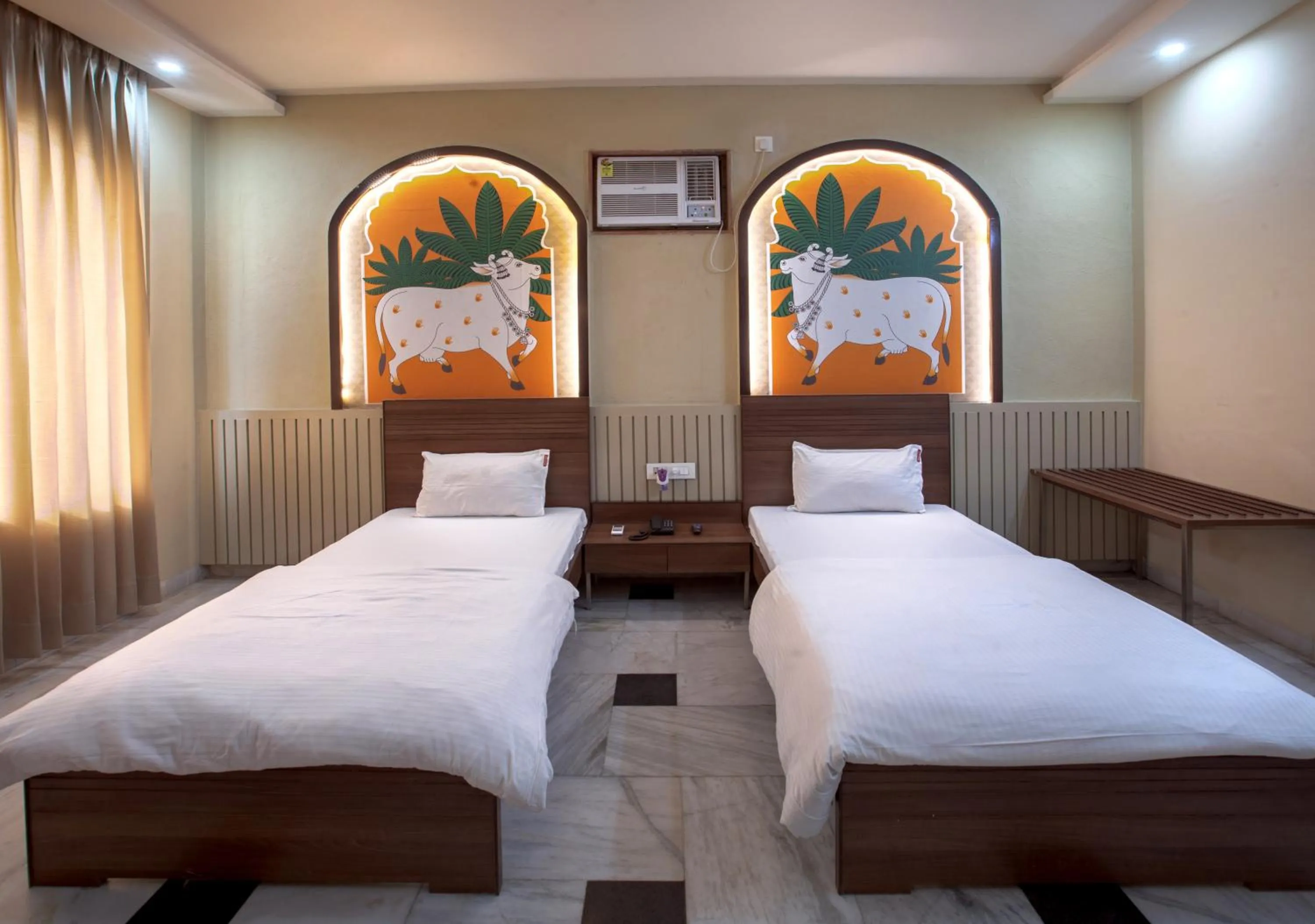 Bed in Hotel Bhakti Dhama