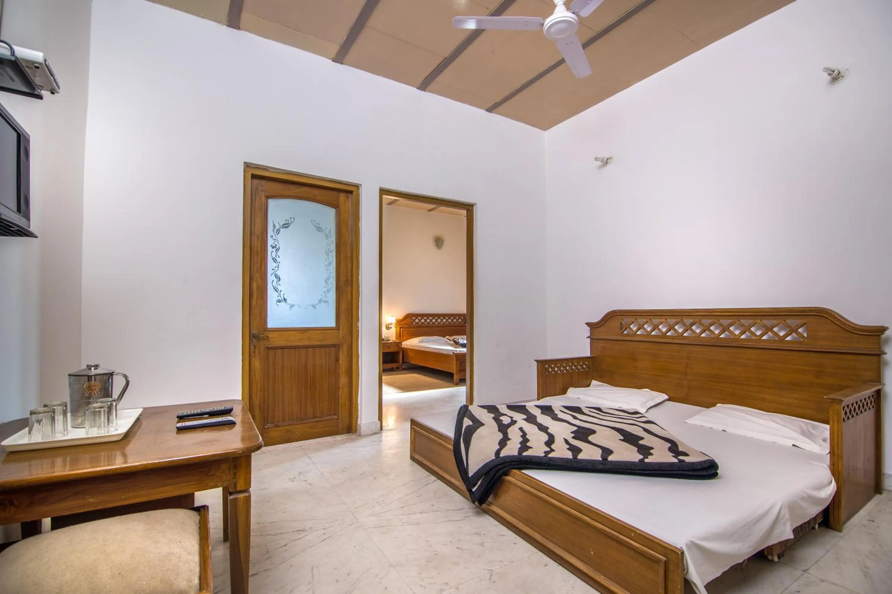 Bed in Hotel Bhakti Dhama