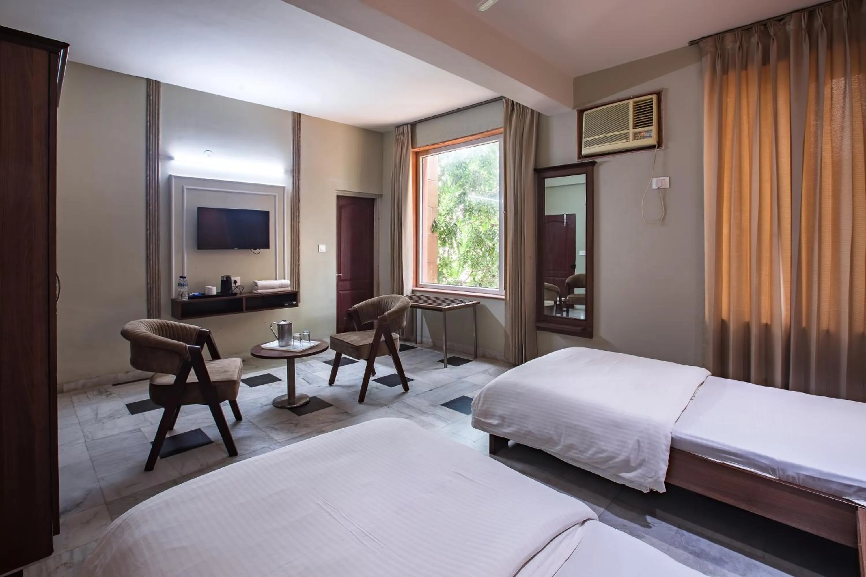 Bed in Hotel Bhakti Dhama