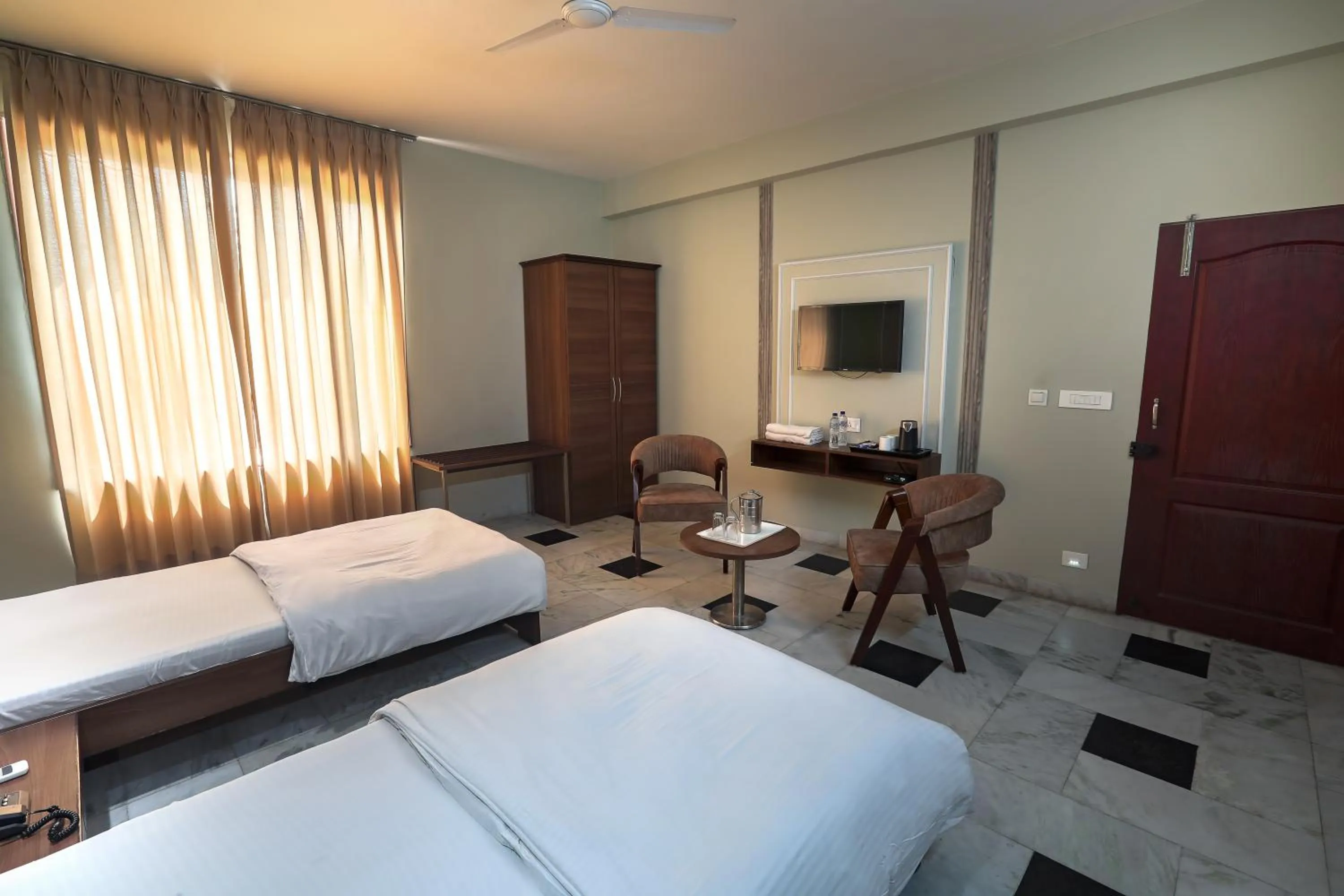 Bed in Hotel Bhakti Dhama