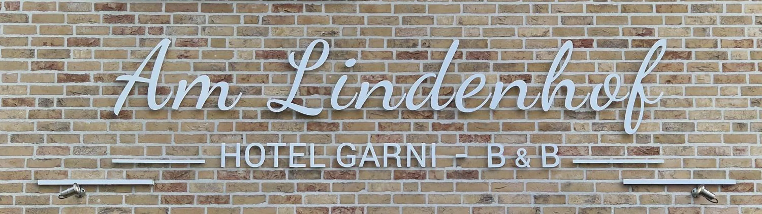 Property logo or sign in Hotel Garni Am Lindenhof Bunde