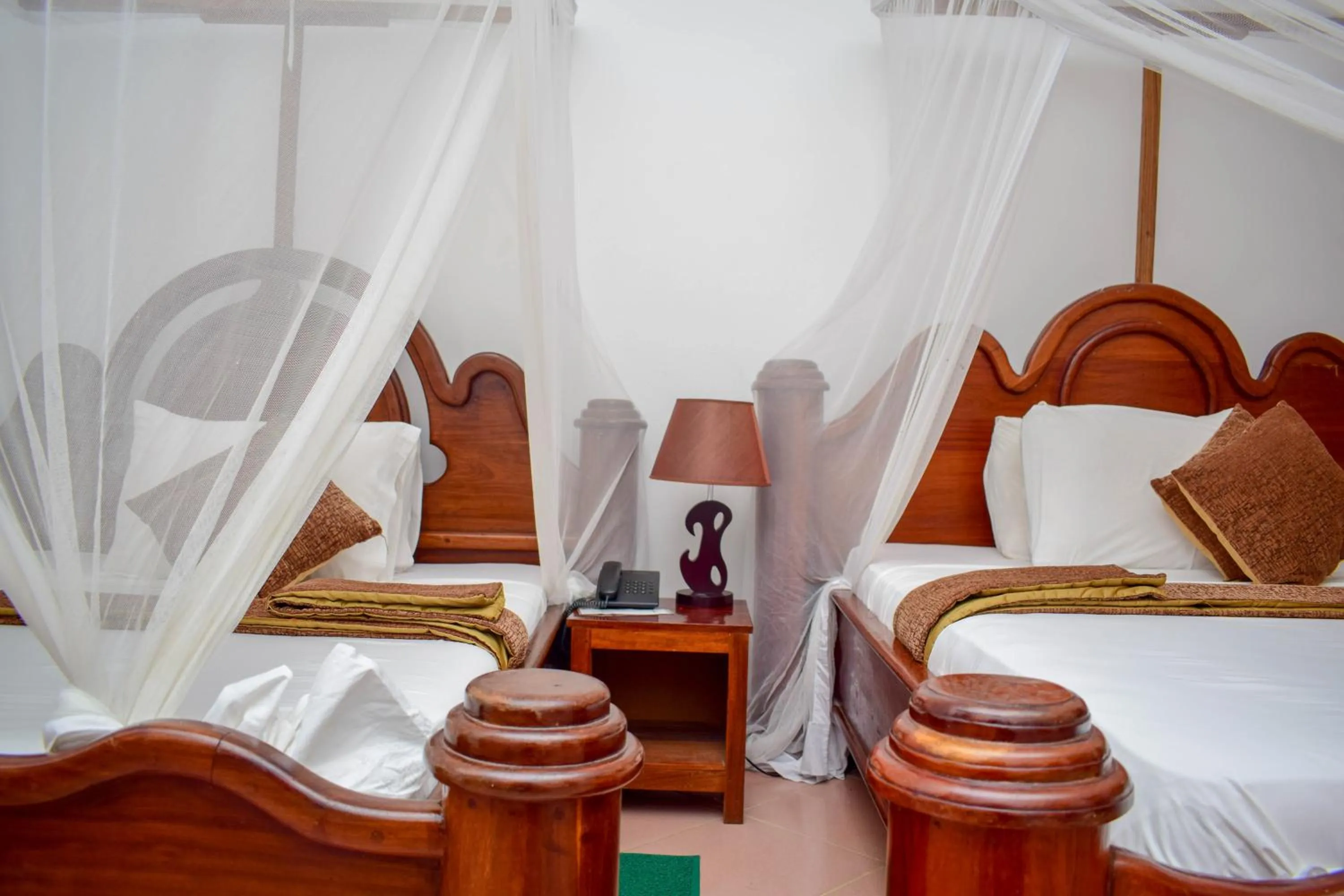 Bed in Zanzibar Ocean View Hotel