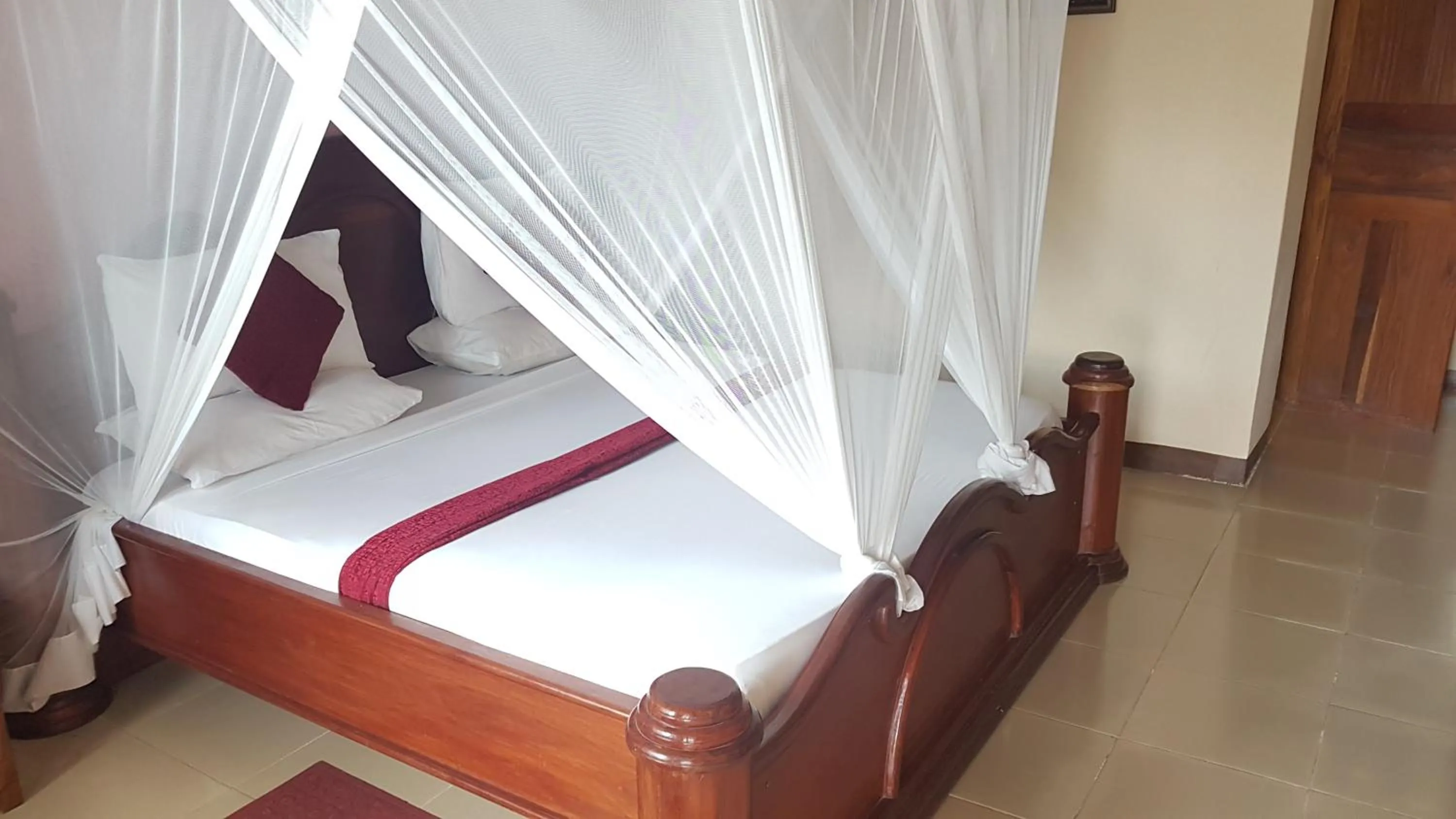 Bed in Zanzibar Ocean View Hotel