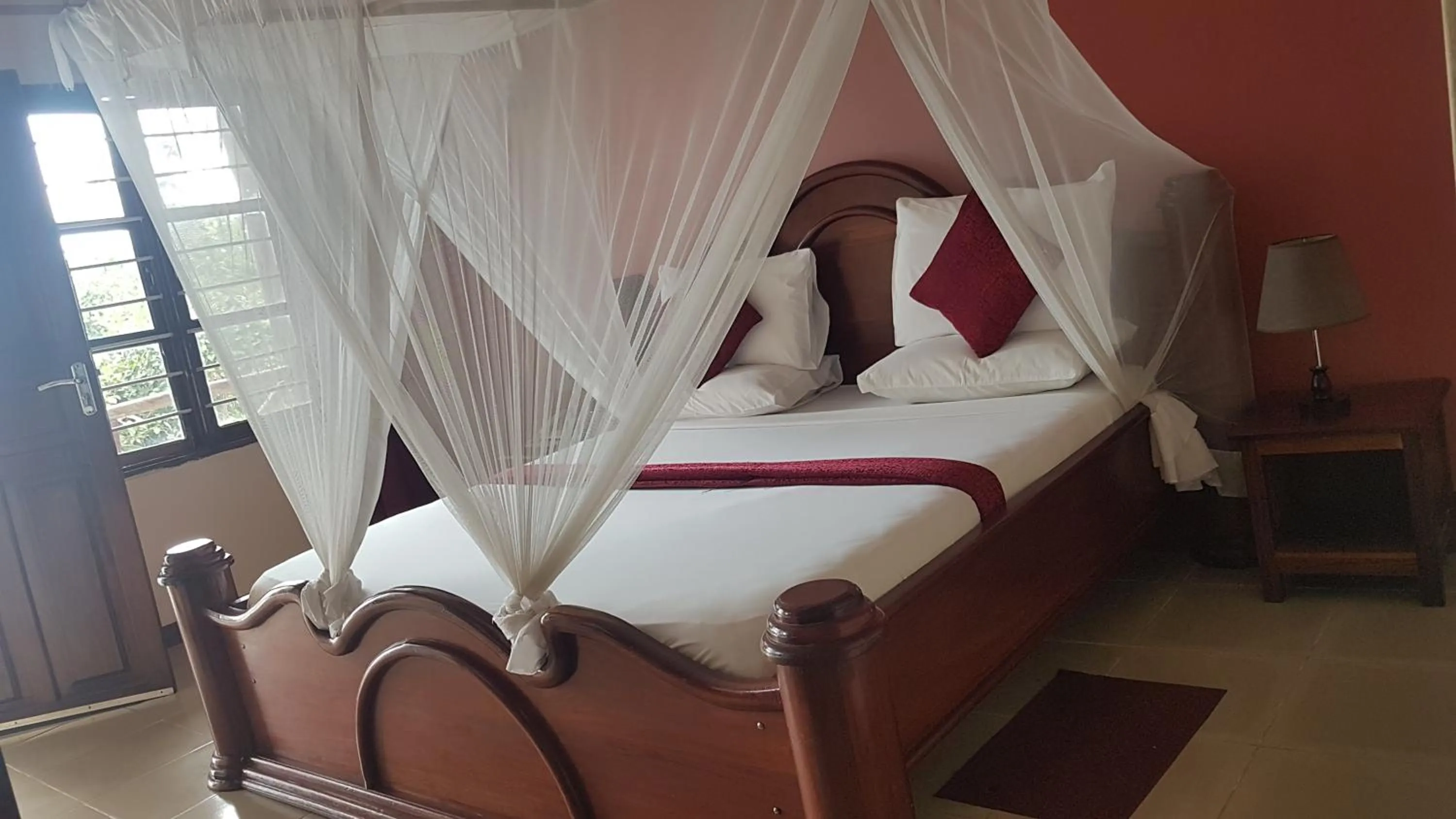 Bed in Zanzibar Ocean View Hotel