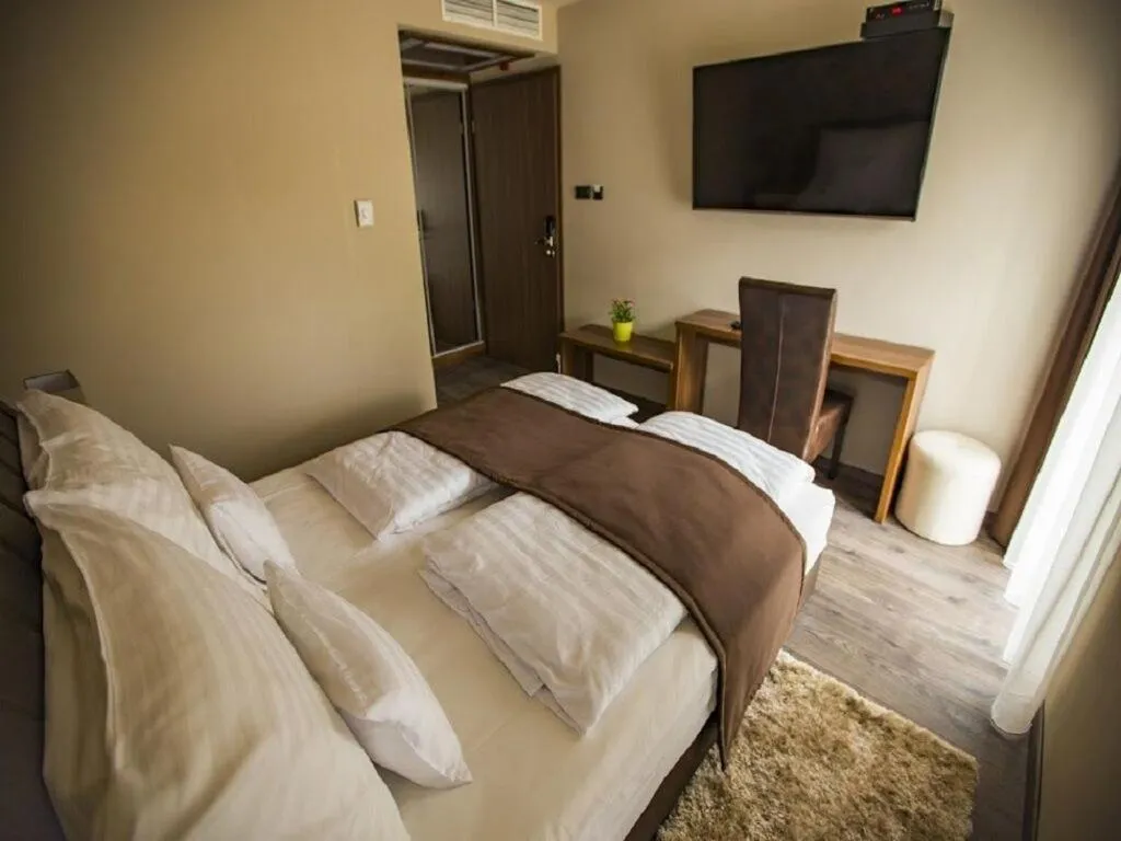 Bed in Pole Position Beach Hotel