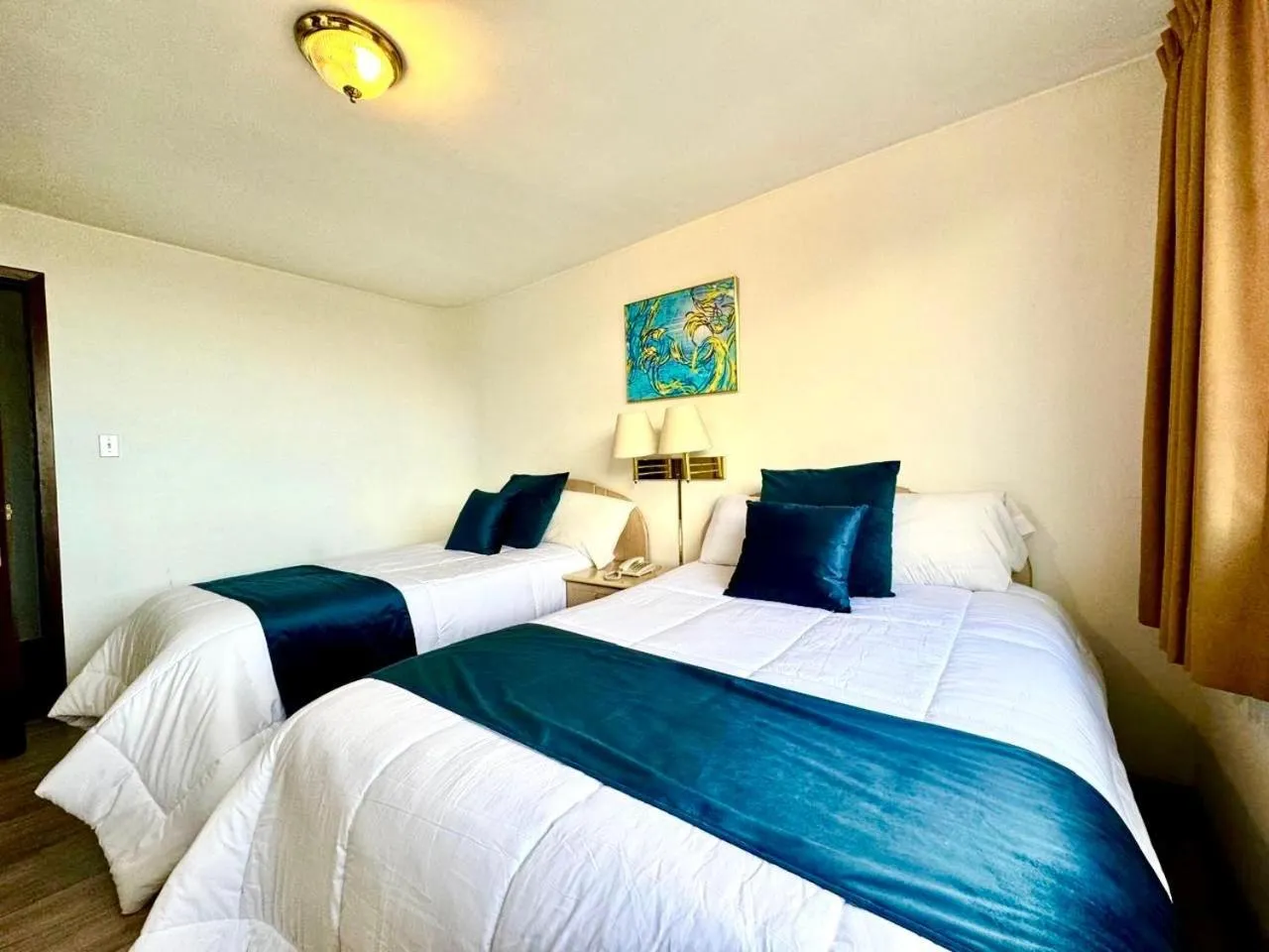 Bed in Stanford Suites Hotel