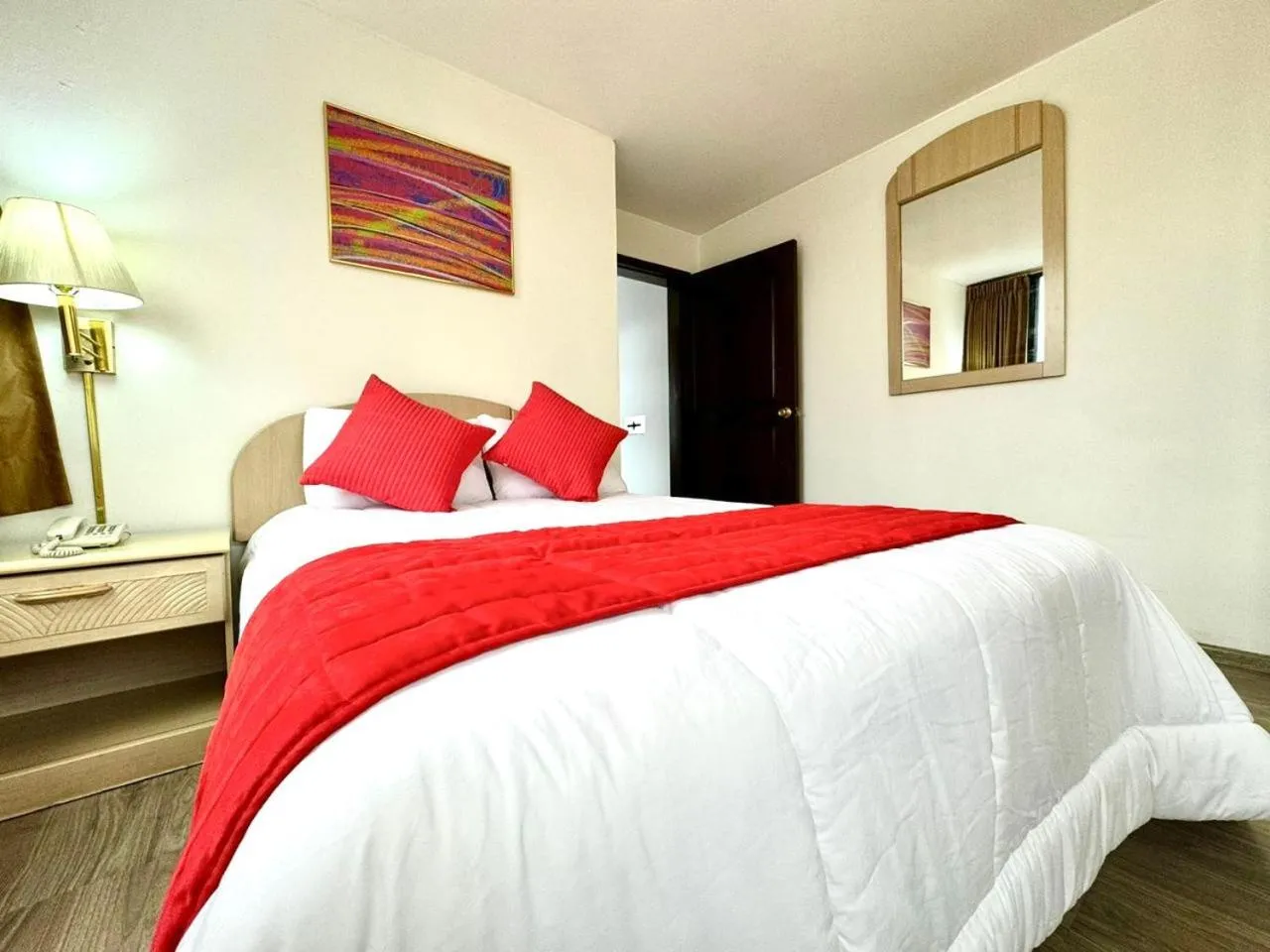 Bed in Stanford Suites Hotel