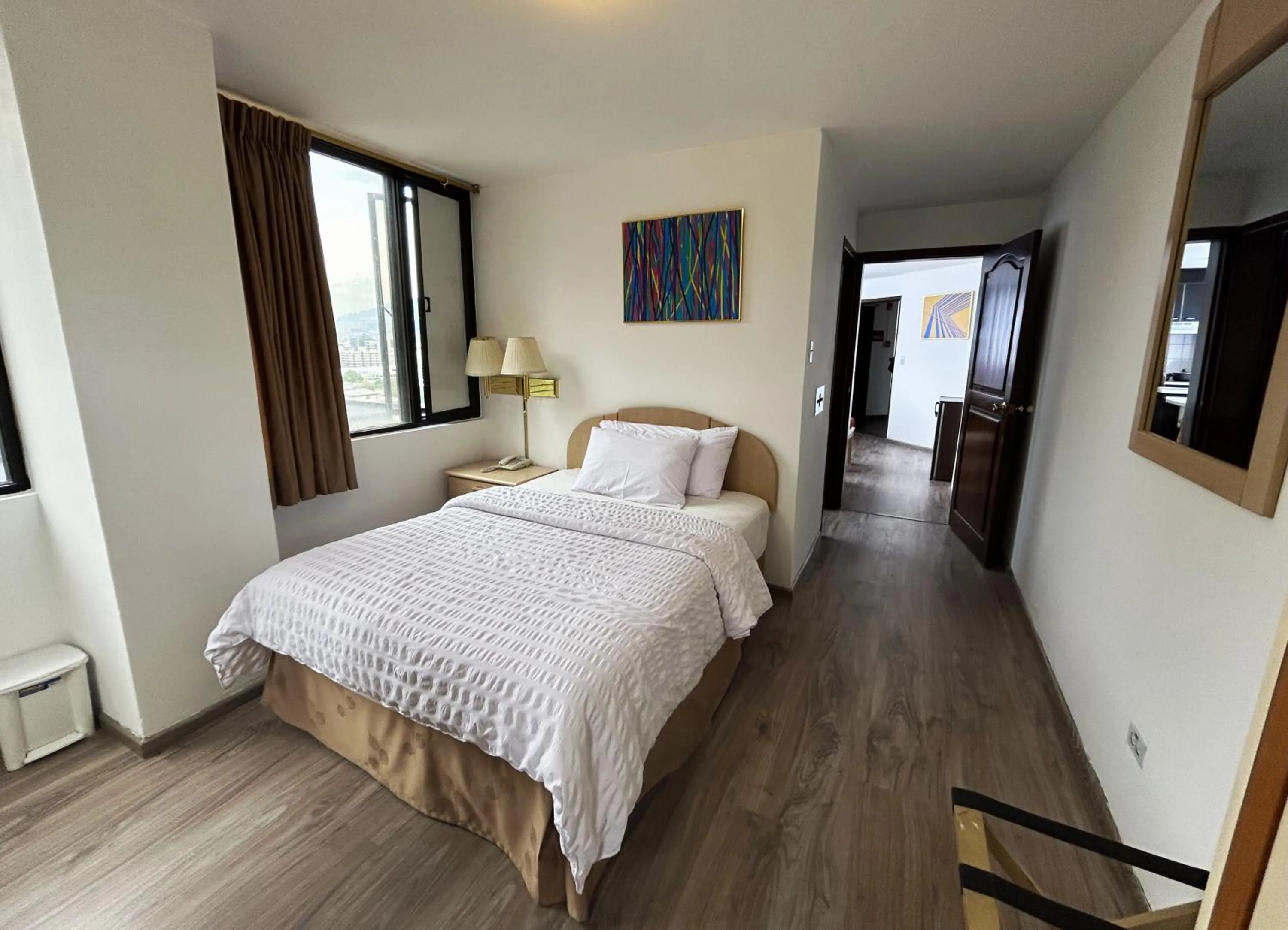 Bed in Stanford Suites Hotel