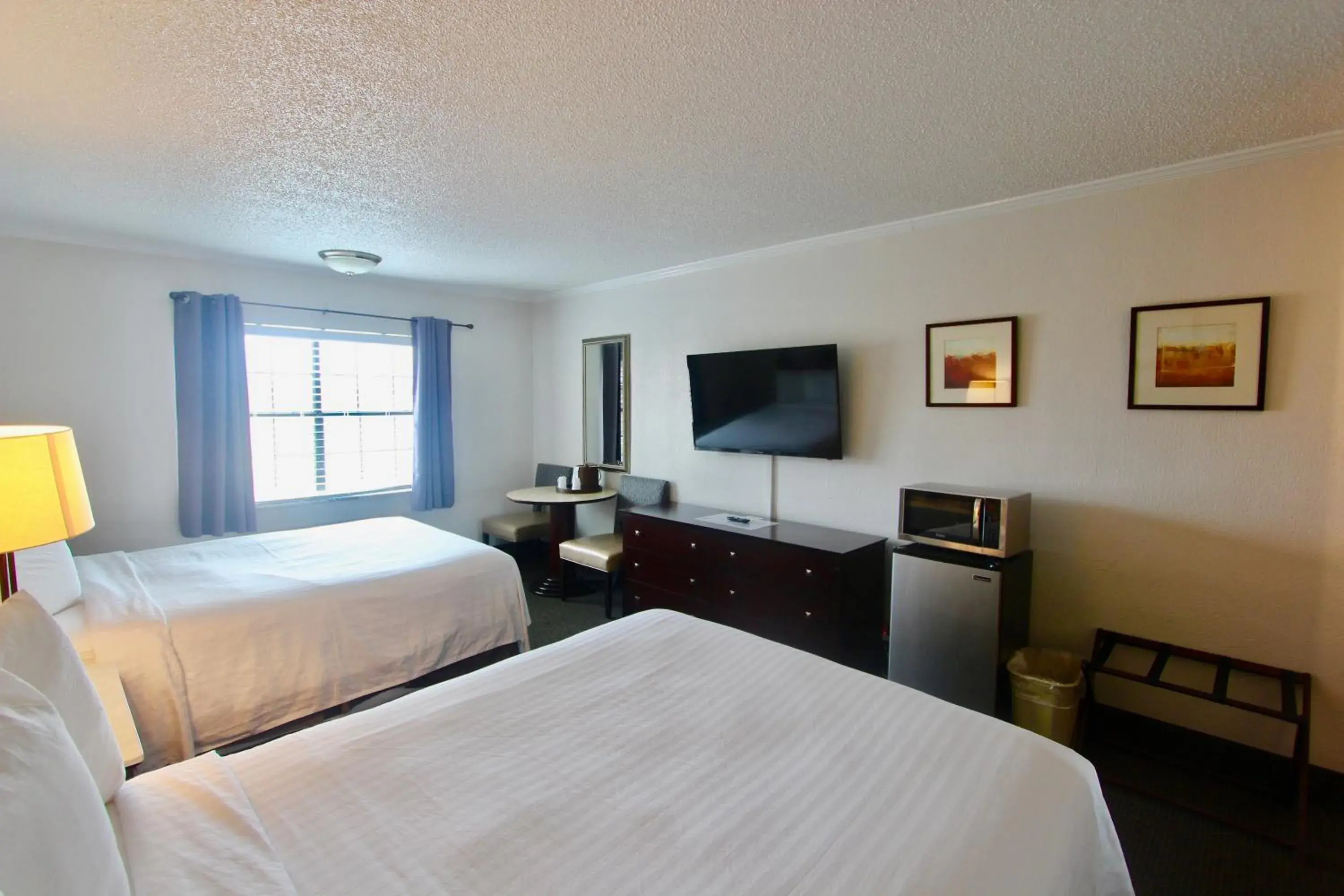 Deluxe Queen Room with Two Queen Beds in At Home Inn - Pensacola Deluxe Queen Room with Two Queen Beds in At Home Inn - Pensacola