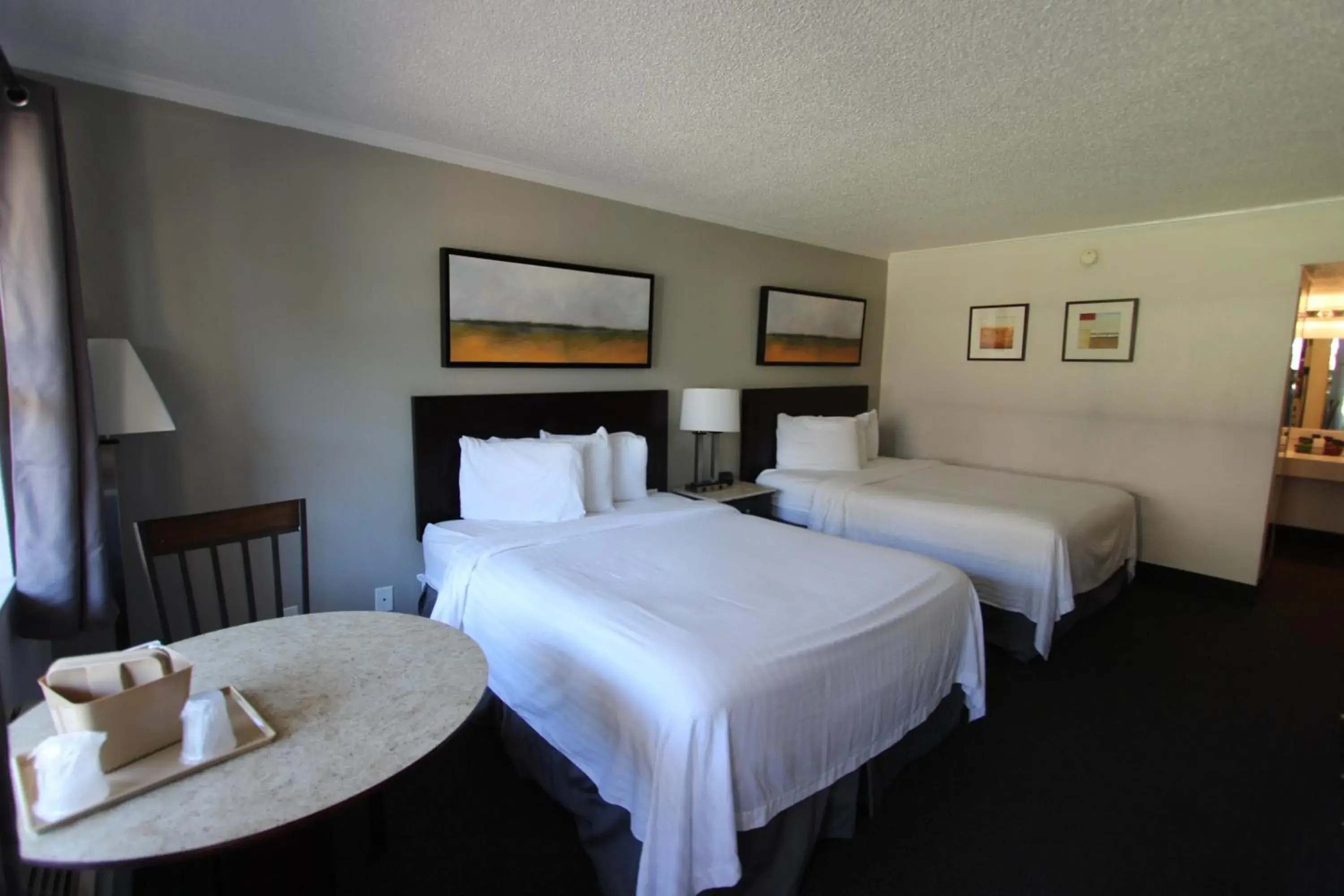 Standard Queen Room with Two Queen Beds in At Home Inn - Pensacola Standard Queen Room with Two Queen Beds in At Home Inn - Pensacola