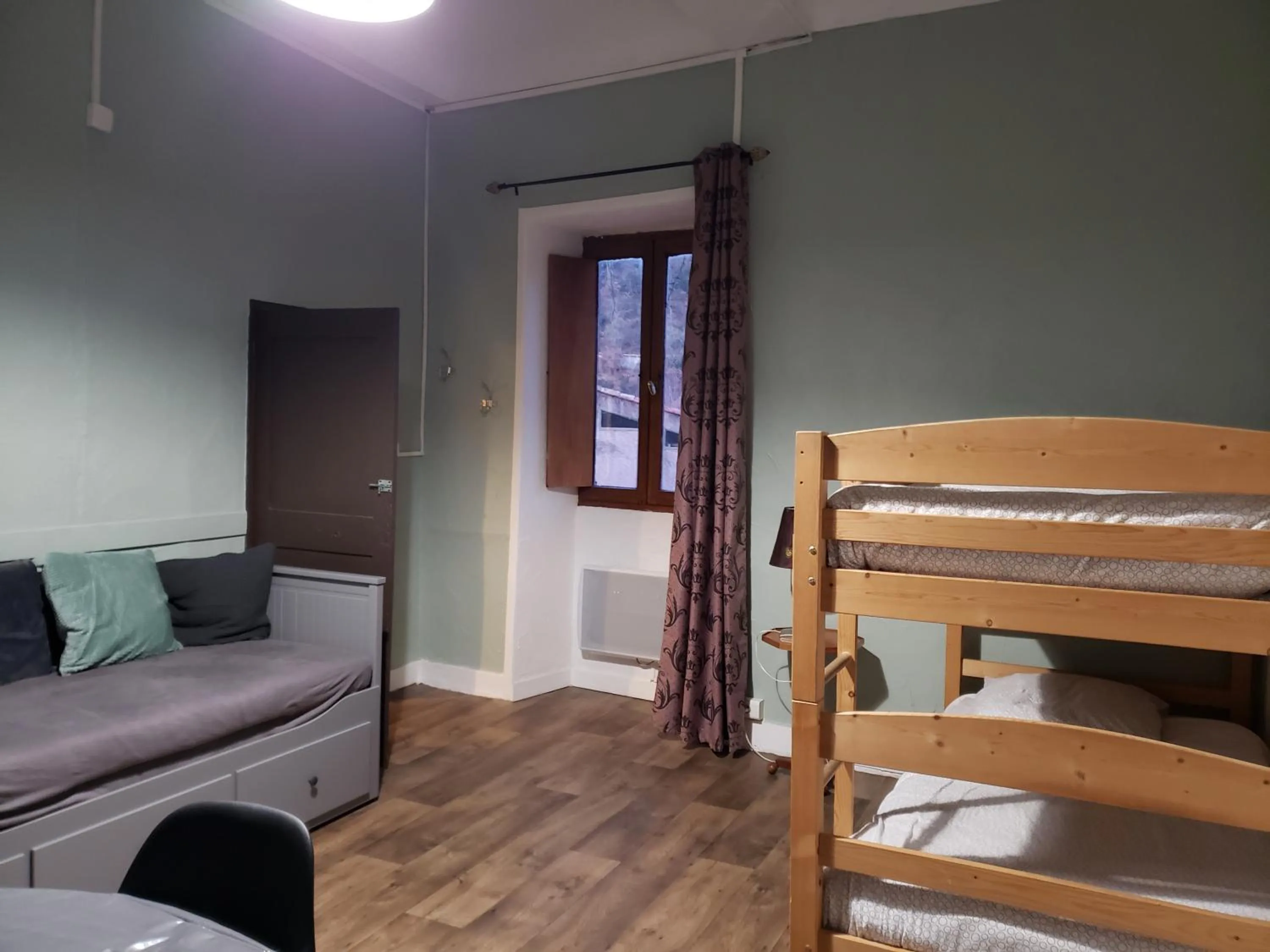 Living room, Bed in Le Moulin D'onclaire Camping et chambres d'hôtes