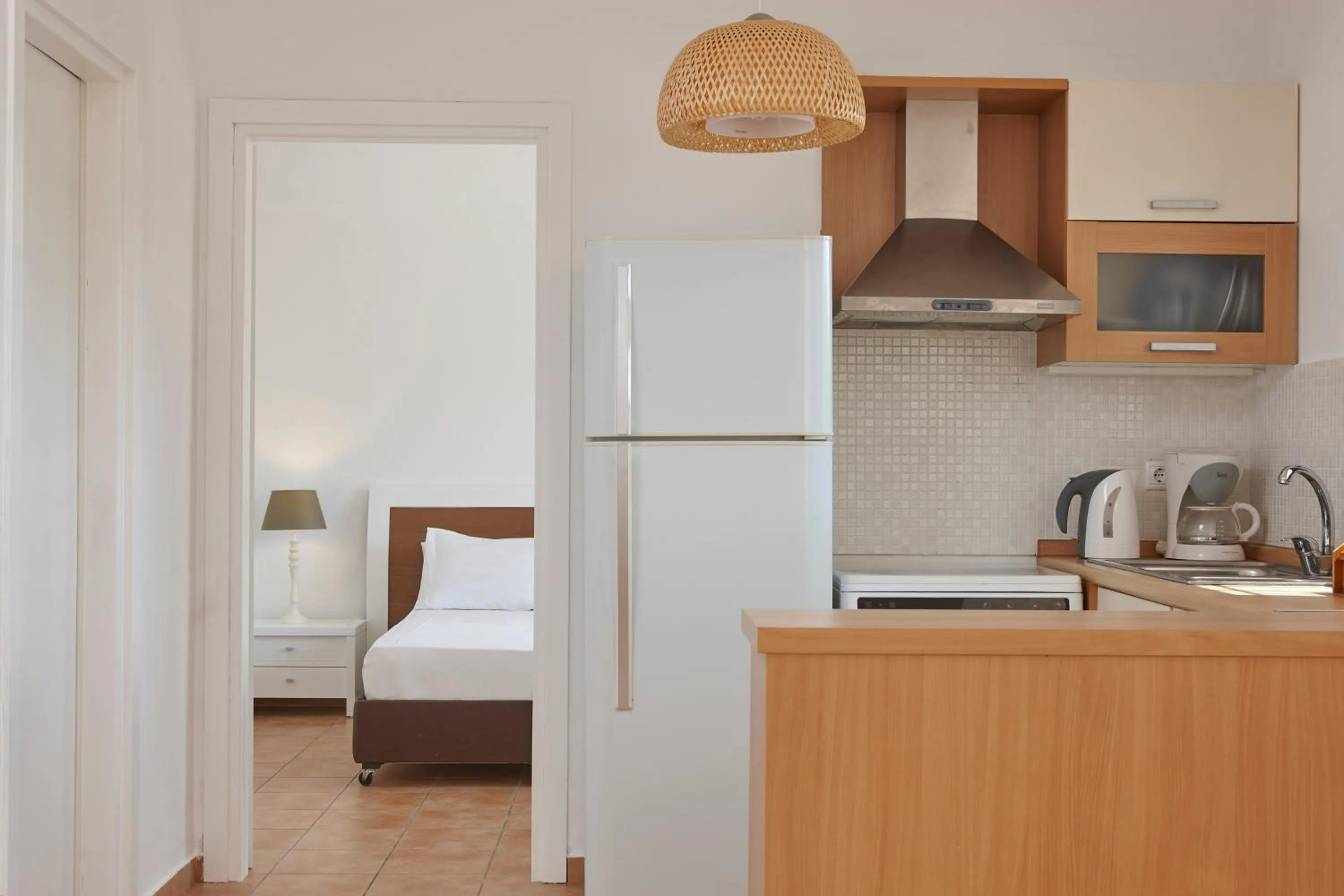 Kitchen or kitchenette, Bed in Anassa Mare Villas & Residences