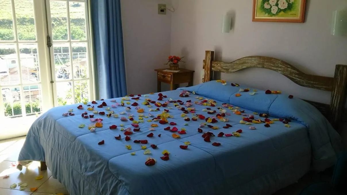 Bed in Pousada D'amoras