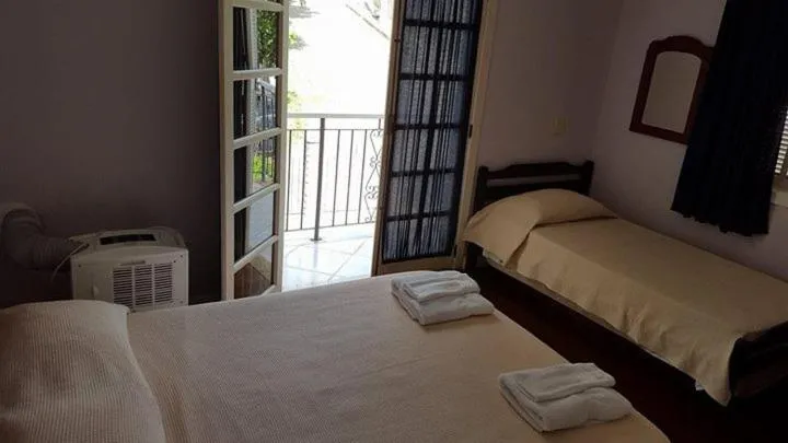 Bed in Pousada D'amoras